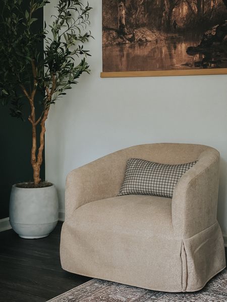 Sitting area with swivel chairs and olive tree. Love this canvas tapestry too -  other prints available  

#LTKStyleTip #LTKHome