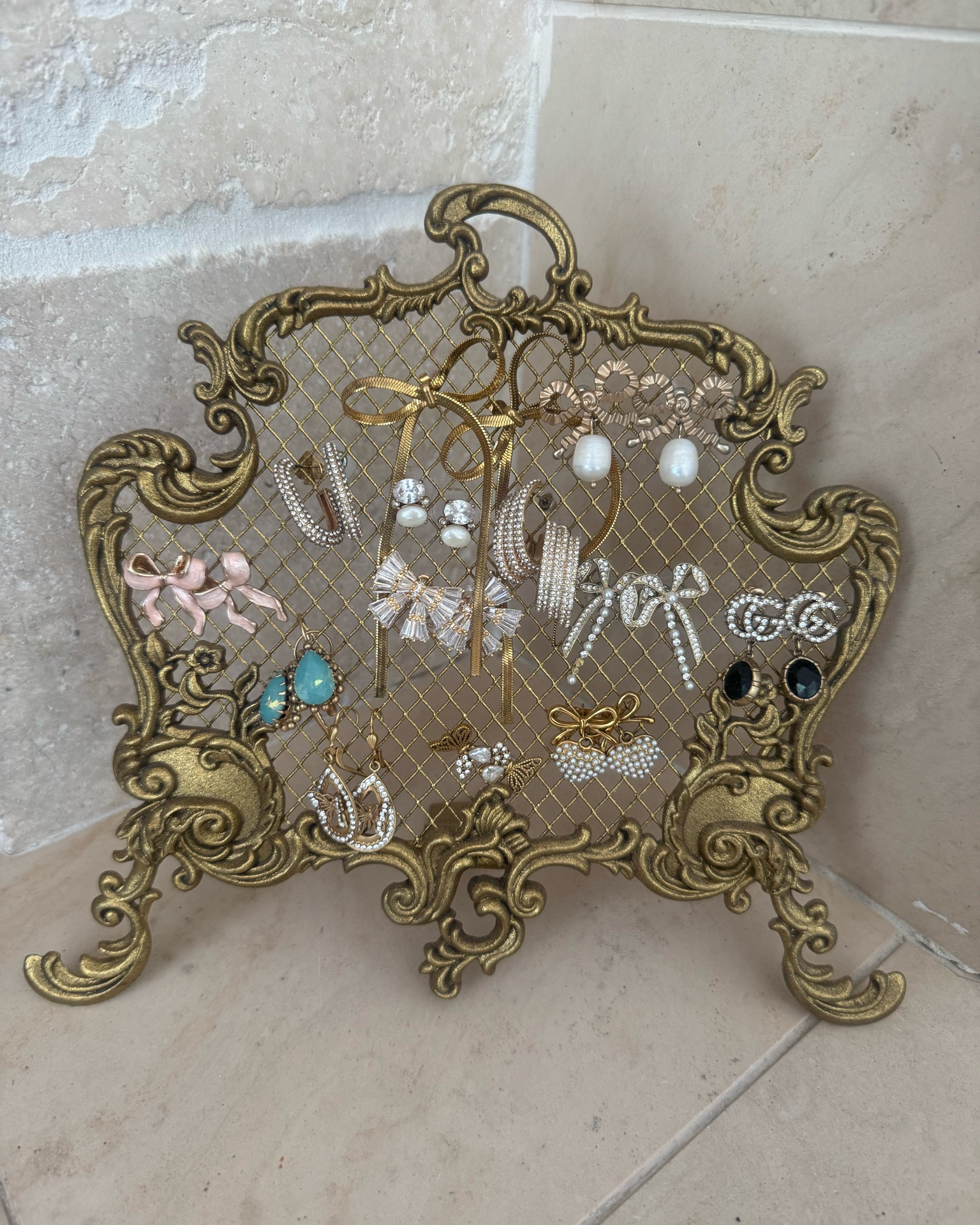 GOLD ORNATE JEWELRY HOLDER
with MESH

I absolutely love my jewelry stand and use it everyday! I display all my jewelry from @suzette_davis and her jewelry company @bijoux.co_jewels on IG
Her prices are soooo good!

Great gift idea too! Especially for a bride-to-be or the jewelry obsessed!