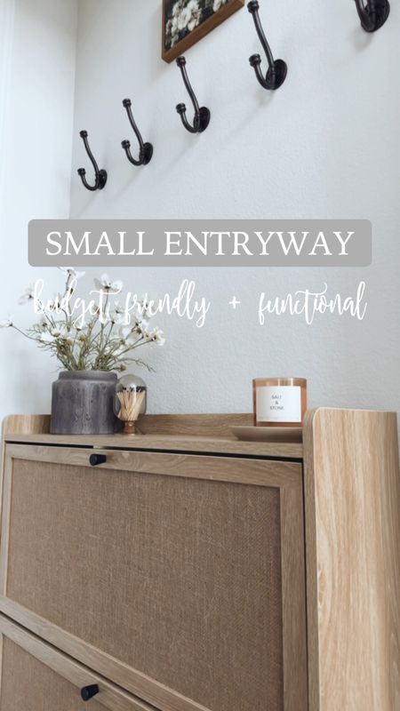 small entryway 🤍✨

that is budget friendly and functional! This is the entry we have by our garage and my husband’s home office. We used to have a console here where I stored our shoes but when I stumbled on this cabinet that concealed everything I knew it would be absolutely perfect here! I LOVE it!

details here:
+ shoe storage cabinet: very affordable and under $80 🤯
+ black planter: Walmart
+ faux florals: these are from Hobby Lobby but found near identical ones on amazon
+ candle I love
+ little candle tray that is an older Target find
+ artwork from Amazon
+ washable runner
+ hooks: Amazon find (still deciding if I want to keep these here. I can still hang shorter sweaters and jackets but because this cabinet is taller than my last, I might remove them. We’ll see 😌)

everything here is linked in my bio! What do you think of it? 👀




#LTKVideo #LTKSeasonal #LTKhome