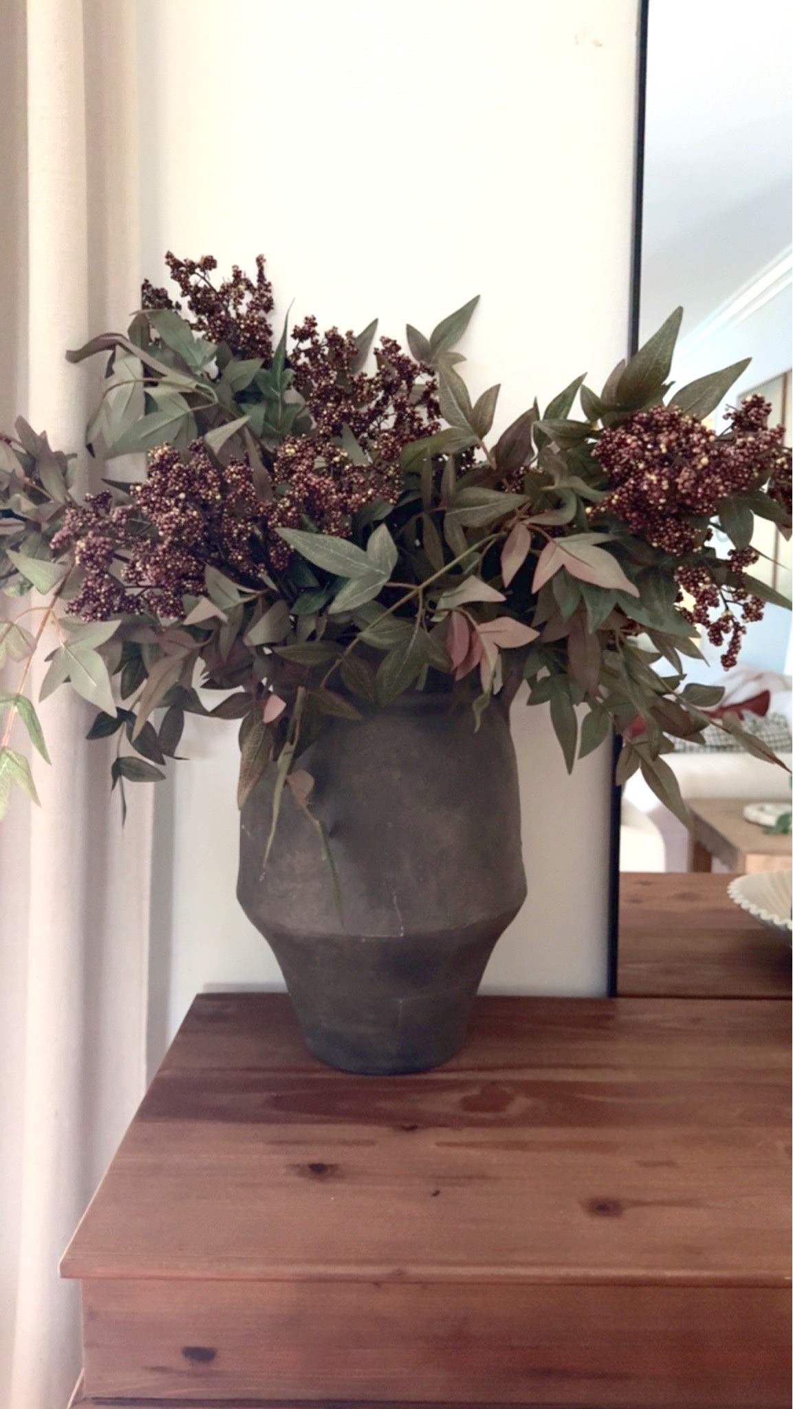 Entryway styling:
I have 4 dusty mauve Berry stems in this vase (the amount you need may vary depending on the size of your vessel opening- a smaller opening would need fewer, where a larger opening will need more) 

My exact vase is several years old and no longer available, but I found a very similar sized option

#LTKSeasonal #LTKHome #LTKdayinmylife