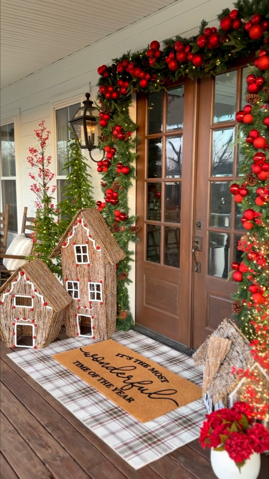 Are you finished decorating for Christmas??🌲 I can’t believe we are only two weeks out! I finally finished my front doors, and this is why I start so early - it takes me forever!

This year I became obsessed with clustered ornaments, and I decided to do that here in my garland as well and what a statement it makes! Highly recommend! shout out to @nearlynaturalfloral for providing the most beautiful pre-lit garland, alpine trees, and ornaments! 

I’m also so glad I was able to incorporate these gingerbread houses because my kids just love them! 🥰

#LTKSeasonal #LTKHoliday #LTKHome