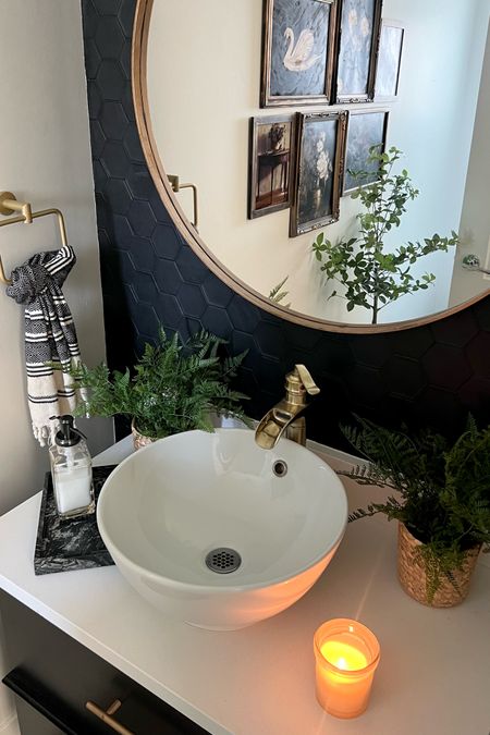 Powder room details: with a few affordable pieces from Target! The small woven planters are a perfect Spring touch. 
Bathroom decor, moody bathroom, moody gallery wall 