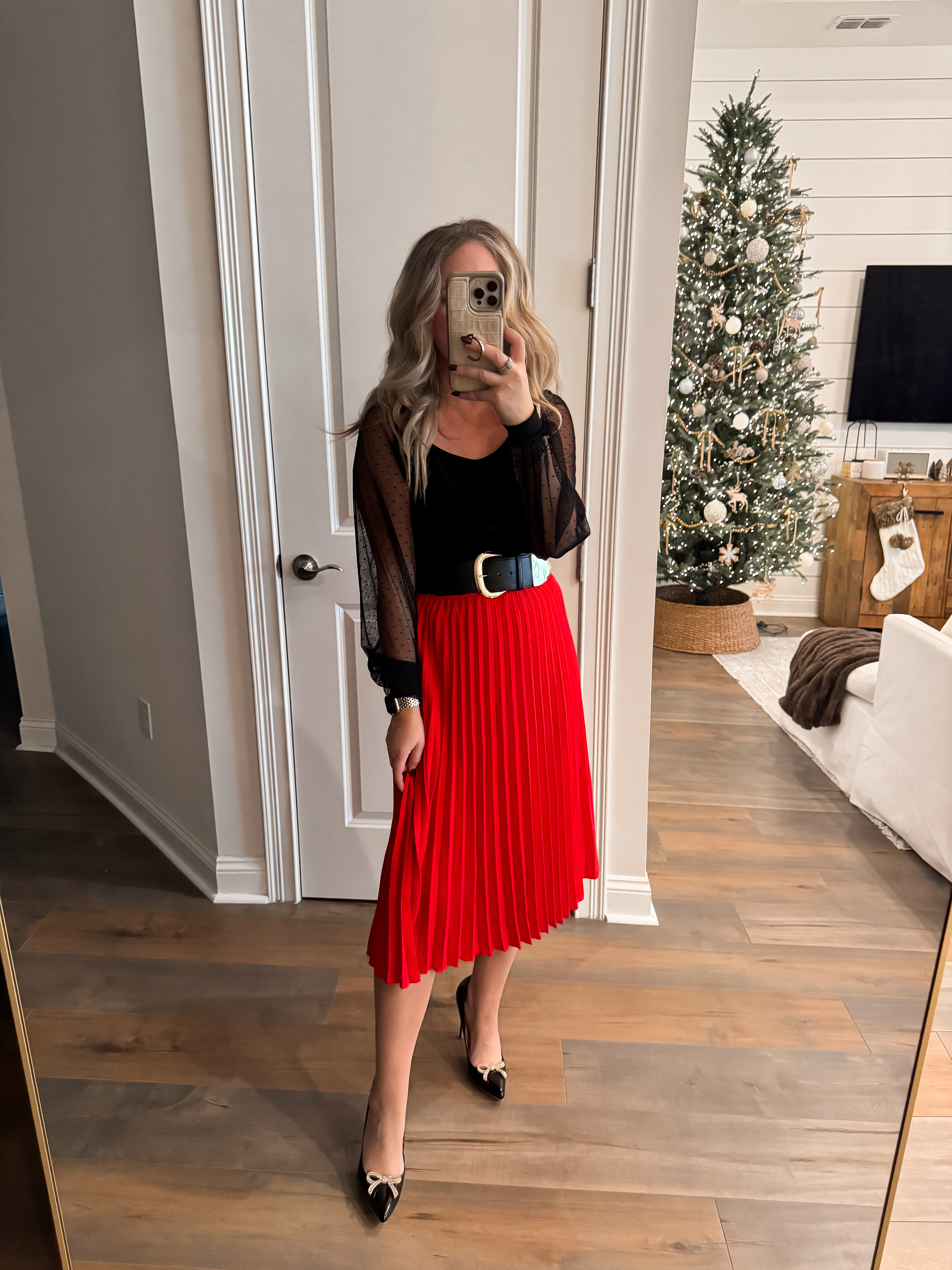 Amazon holiday outfit inspo ✨ Christmas, holiday party, event look, winter fashion, affordable women's fashion finds, pleated red skirt midi, mesh black long sleeve, black heels, sequin bows, belt, Amazon fashion. Wearing size S in both. 

 #LTKHoliday #LTKootd #LTKFindsUnder50