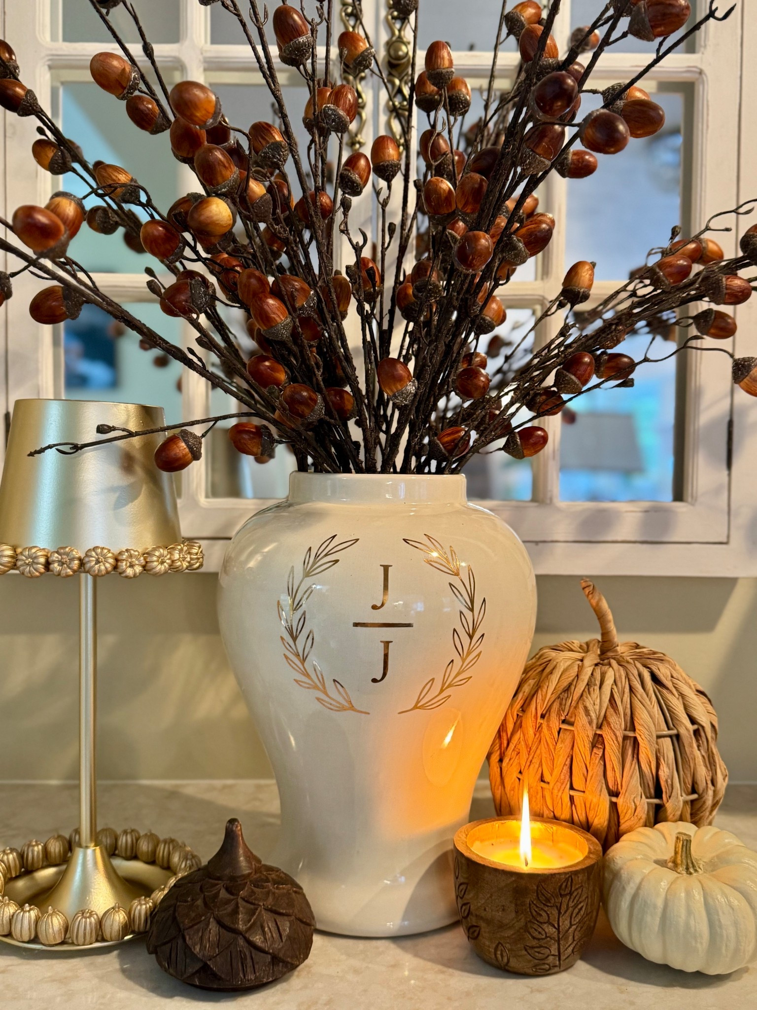 A cozy autumn vignette featuring a personalized monogrammed vase filled with acorn branches, paired with woven and white pumpkins, a glowing fall candle, and warm golden accents. Perfect for adding a welcoming seasonal touch to your home décor. 🍂✨

#LTKhome #LTKseasonal #LTKdecor #LTKfall #fallstyling #fallvignette #falldecor #pumpkindecor #homedecorinspo #homestyling #tablescapestyling #fallfavorites #cozyhome #autumnvibes #seasonaldecor

#LTKSeasonal #LTKHome #LTKStyleTip