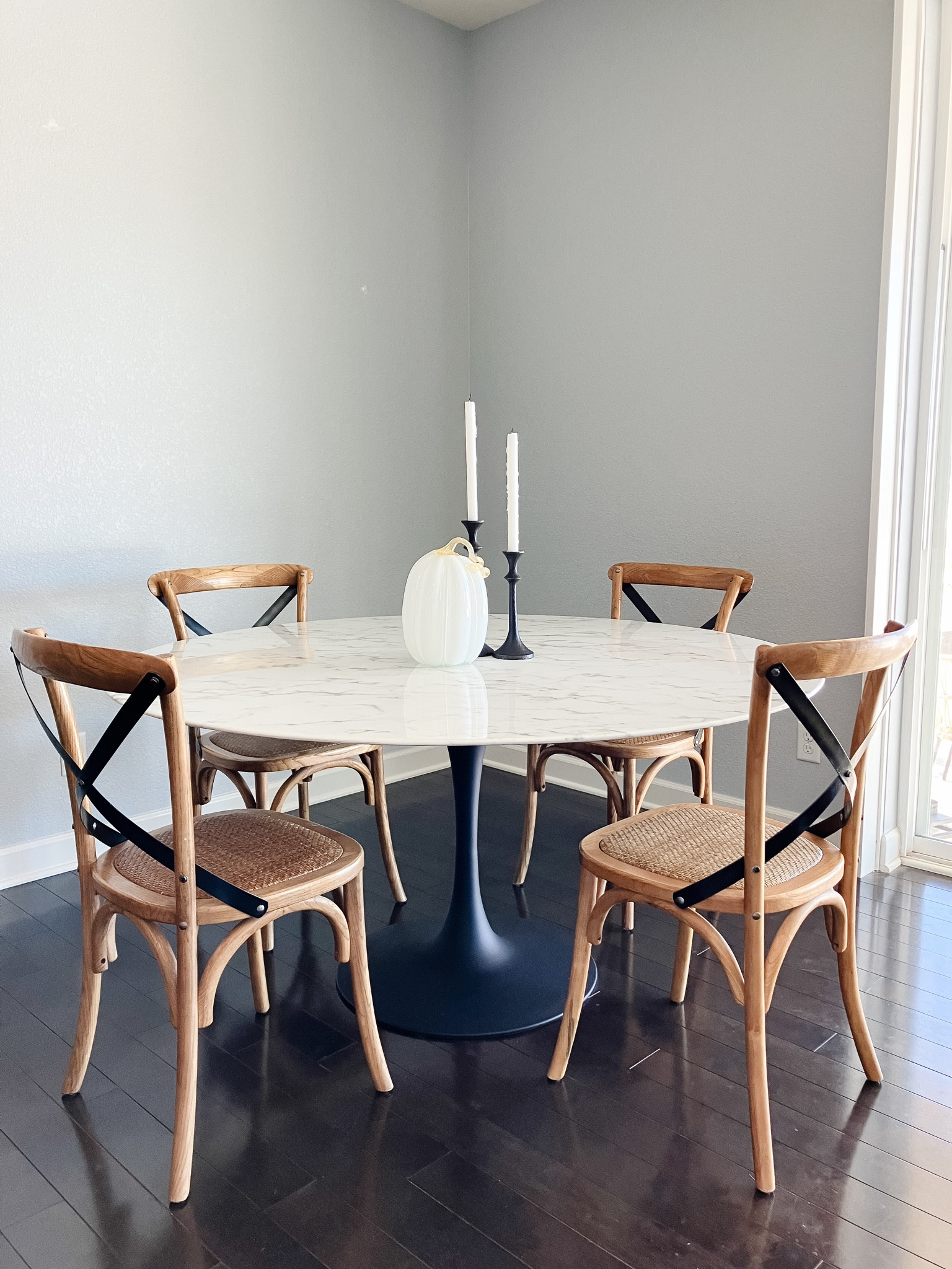 Our very simple dining space! I love a round dining table and searched high and low for one like this at an affordable price. Looks just like marble. They don’t sell my exact colorway dining chair anymore with the black back but the one linked is the same wood color. 

#LTKHoliday #LTKhome