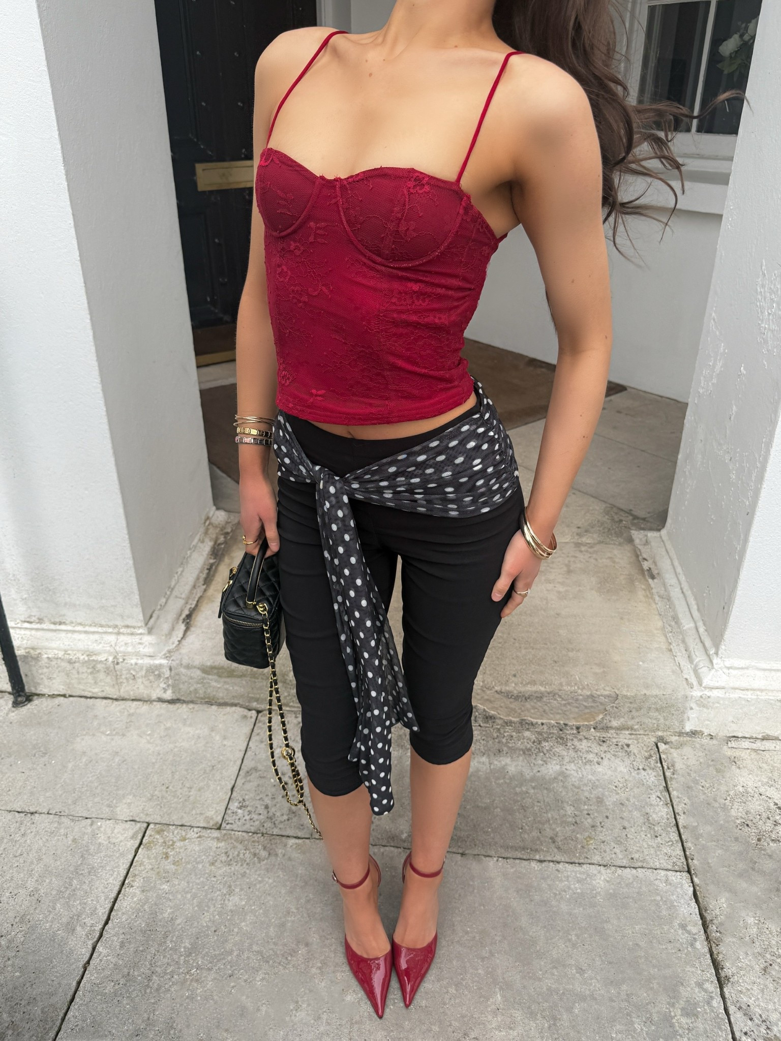 outfit inspo, outfit inspiration, spring outfits,  dressy outfits, red top, red lace top, corset top, capri pants, black capri pants, polka dot capris trousers, red heels, black bag, box bag 

#LTKeurope #LTKspring