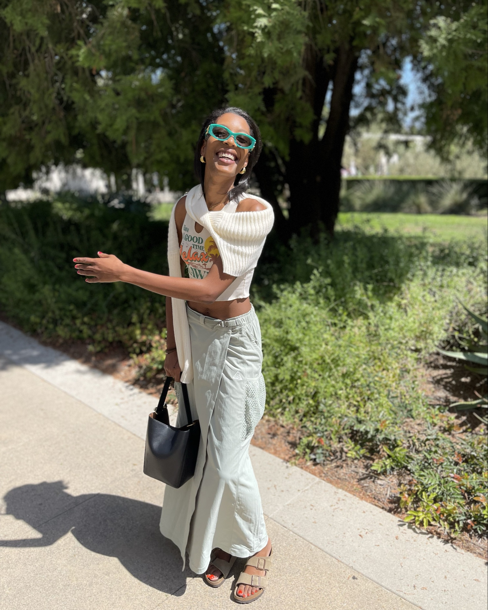 A Garden Day in LA OOTD 🌸

✨Top - Hawaii baby tank from Temu
✨Sweater - cropped long sleeve from Temu
✨Skirt - Nike ACG Snowgrass UV skirt in Jade Horizon/Summit White
✨Bag - Zara minimalistic bucket bag in Black
✨Shoes - Birkenstock Arizona Soft Foot bed in Taupe 
✨Glasses - Miu Miu Glimpse Glasses (MU 11WS) in Green
✨Jewelry- gold hoops from target, herringbone chain from Ana Luisa

#LTKStyleTip #LTKSaleAlert #LTKGiftGuide