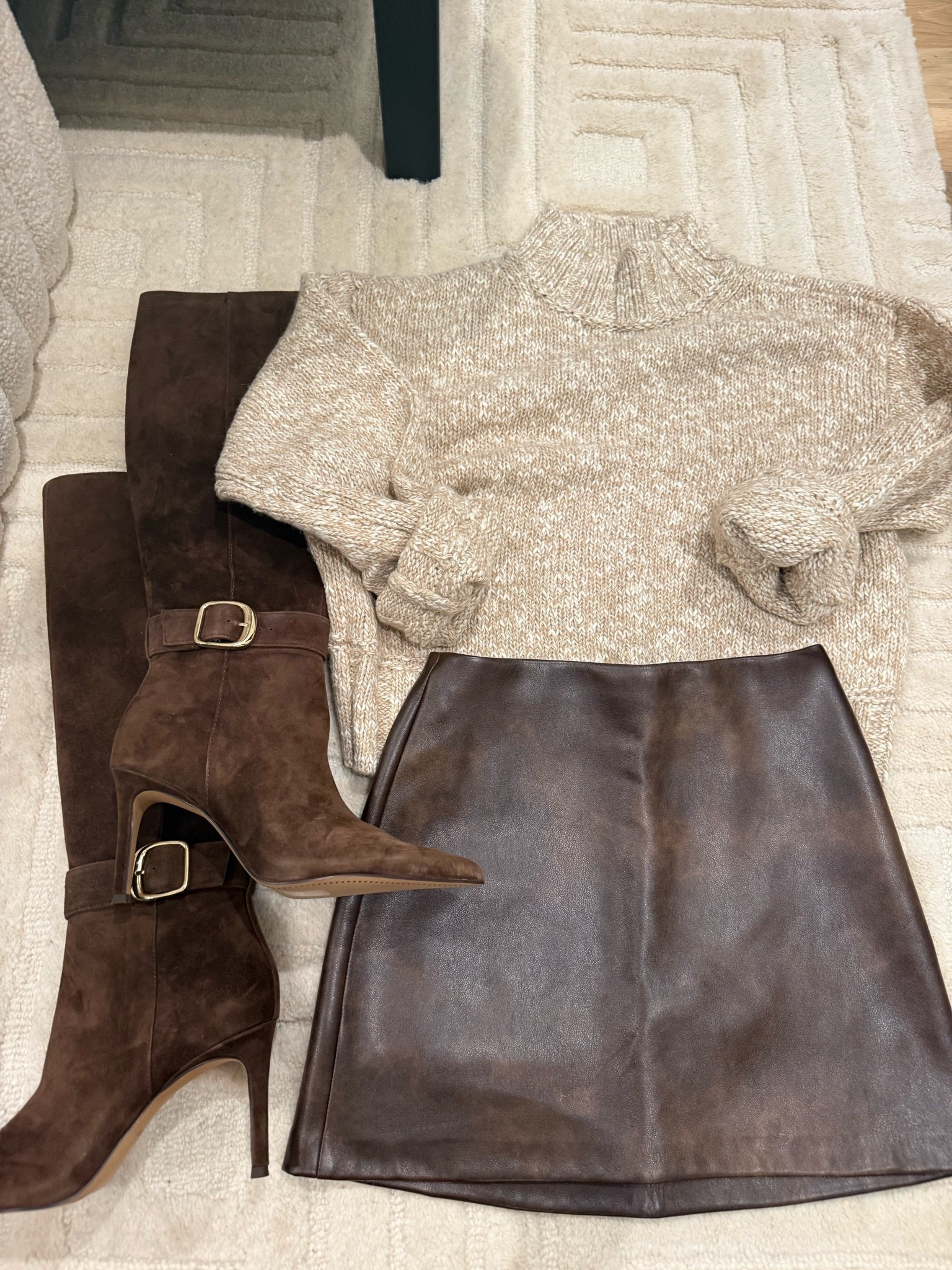 Fall outfit idea pairing this neutral sweater with brown faux leather skirt and brown suede boots
