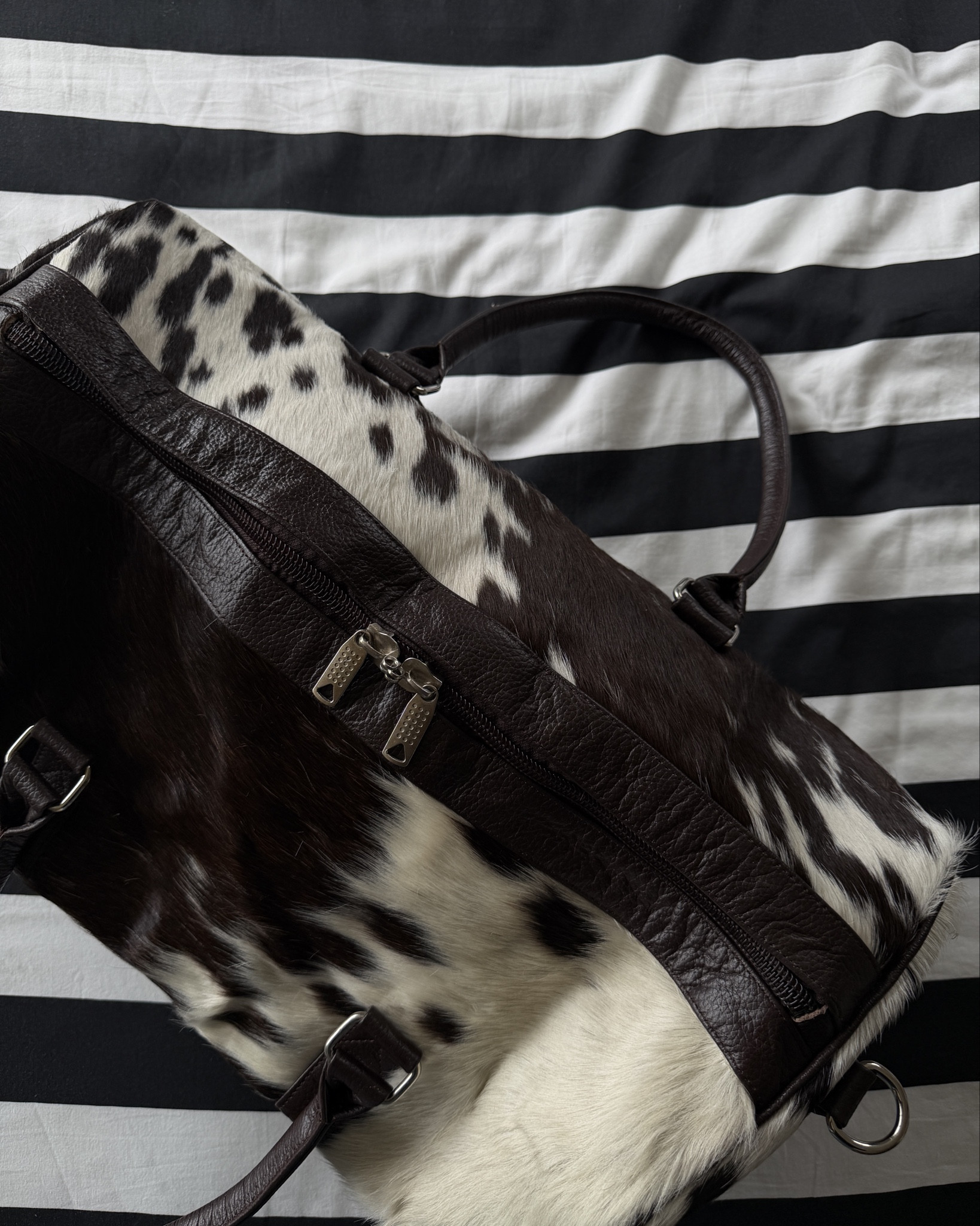 Cowhide duffle! 

#LTKHome #LTKTravel #LTKgrwm
