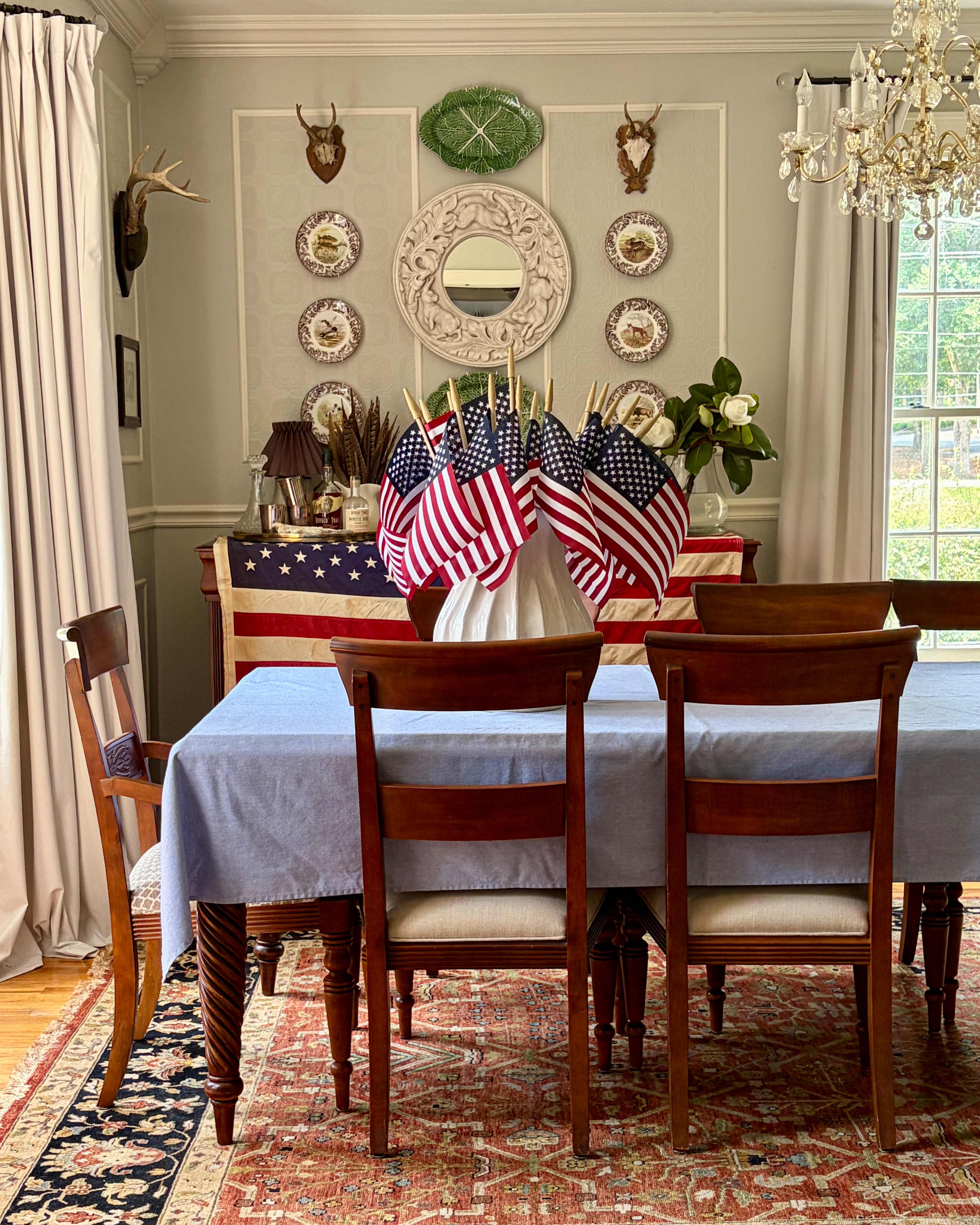 Americana style is having a moment, but the best versions aren't built around trends. They're built around classic pieces that feel collected, comfortable, and timeless.

I've linked similar pieces inspired by this room, including traditional furniture, blue and white accents, and summer décor favorites.
 

 #LTKSeasonal #LTKHome #LTKSaleAlert