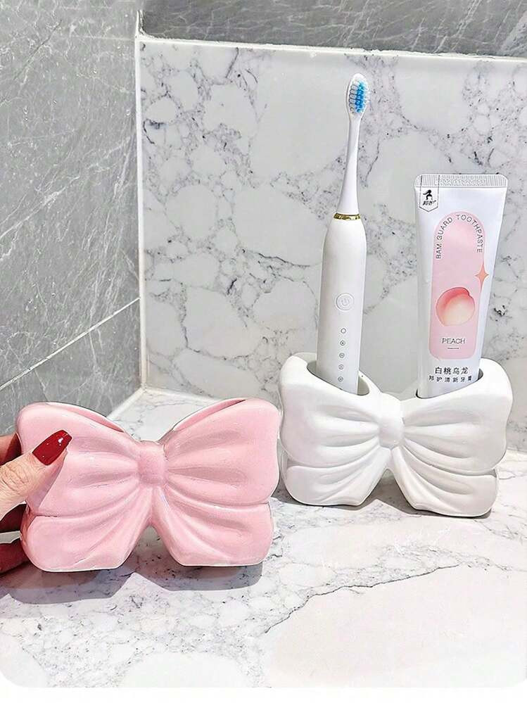 $6.06       
    $13.90
   
  -56%
        1pc Nordic Style Asymmetric Bow Toothbrush Holder, Ele... | SHEIN