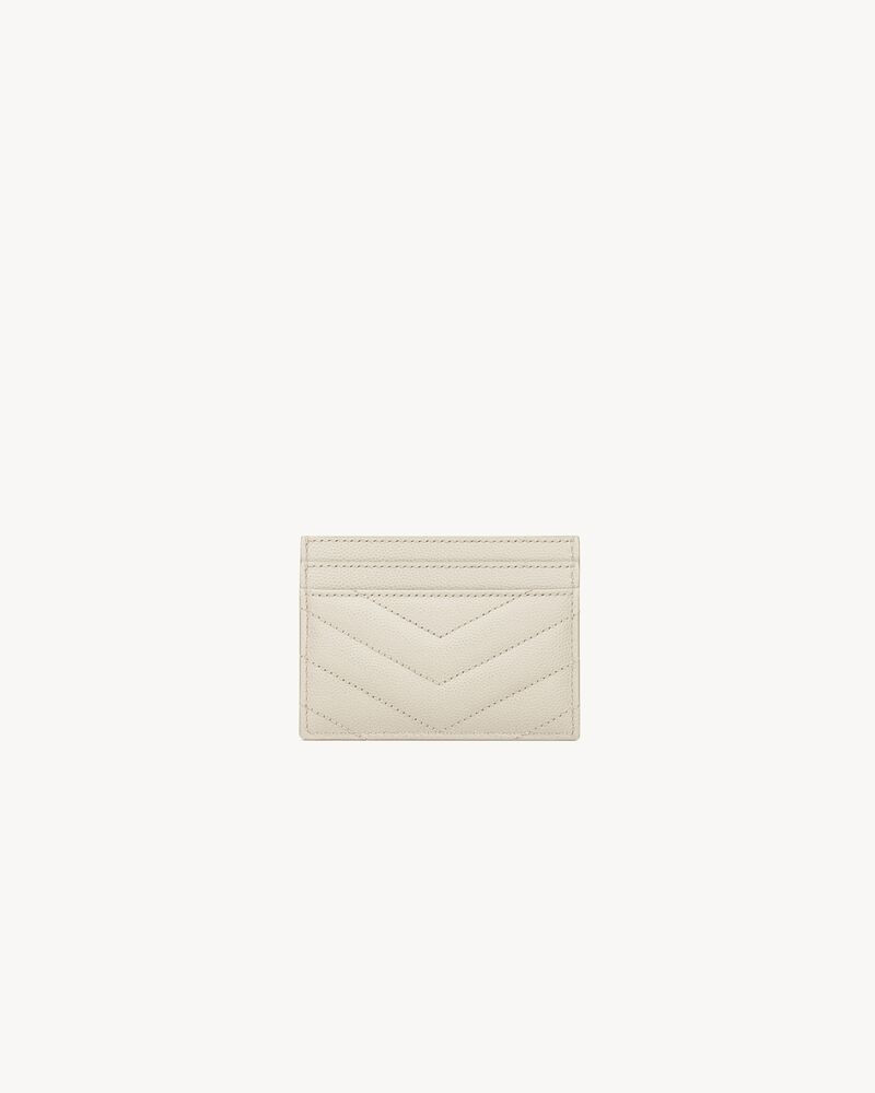 Card holder made with metal-free tanned leather, decorated with metal YSL signature and quilted o... | Saint Laurent Inc. (Global)