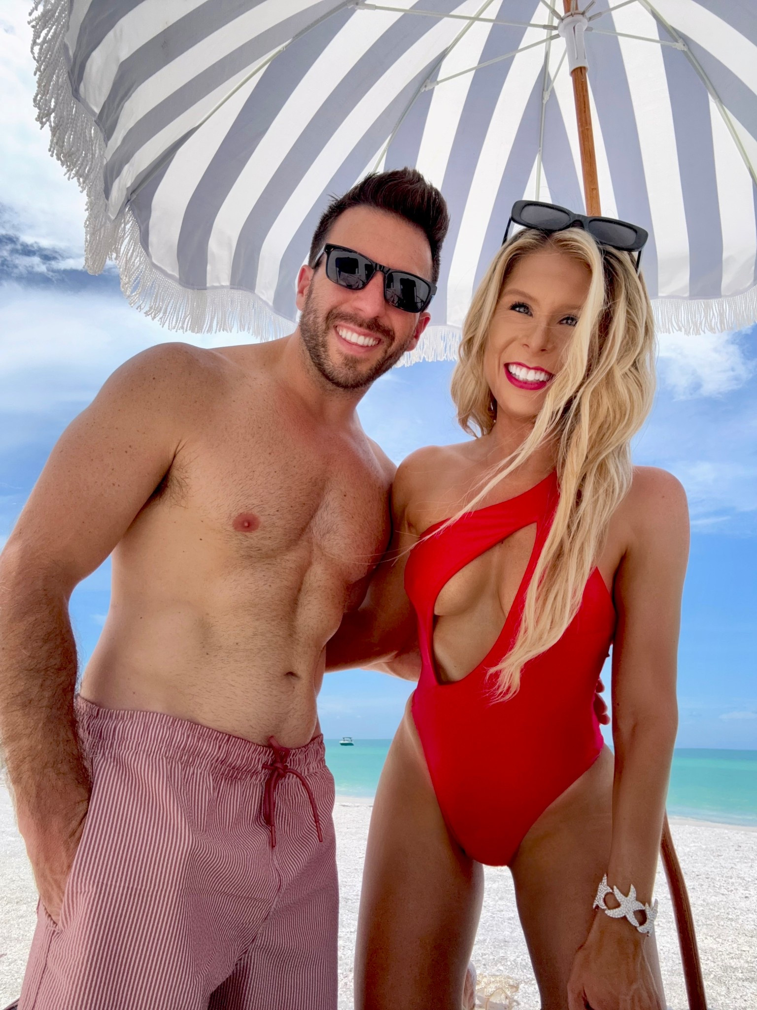 Red One-Piece Bathing Suit! Add this one-shoulder red swimsuit to the cart during the Nordstrom sale. This red bathing suit with a sexy cutout detail also comes in black, white, mauve and a neutral taupe. I styled the red swimsuit with starfish jewelry for a beachy aesthetic. It’s perfect for the beach, pool, vacation or resort. 

My husband is wearing the 5 in men’s swim trunks that come in a variety of colors and patterns. His swimsuit is on Sale! 

#LTKTravel #LTKSaleAlert #LTKSwim