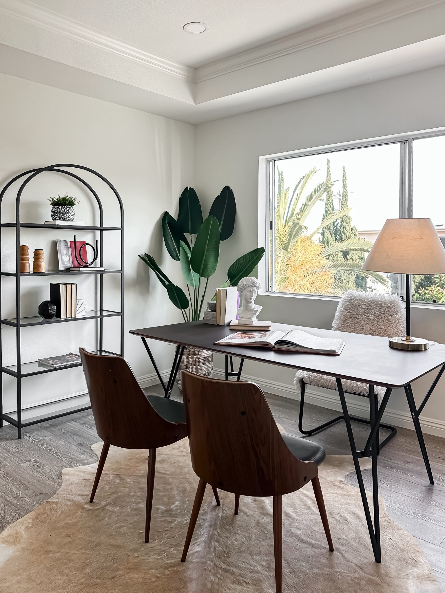 Home office goals: Bright light, lush greenery, and a beautiful mix of black metal and warm wood.

#LTKHome