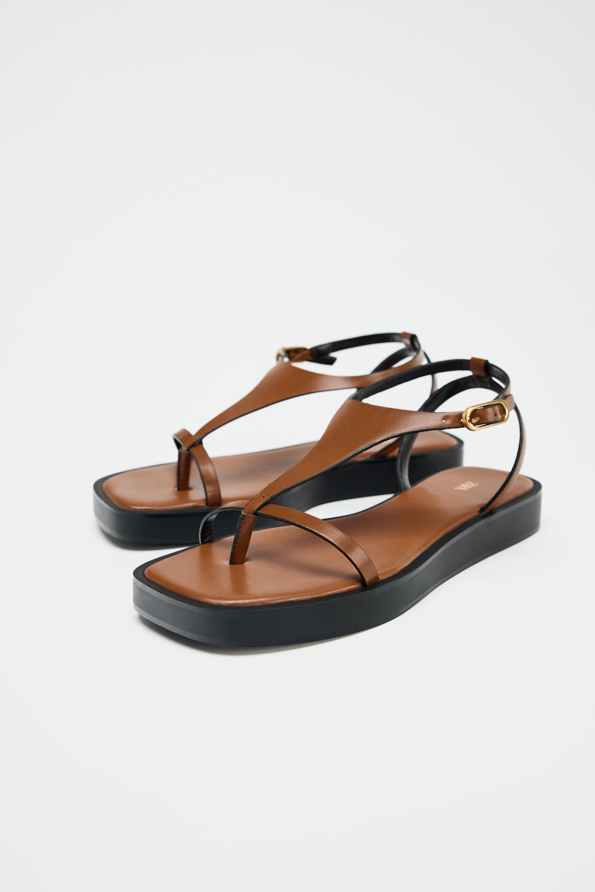 Flat sandal-style shoes. Strappy detail. Ankle strap with metal buckle closure. Square toe.Sole h... | Zara US