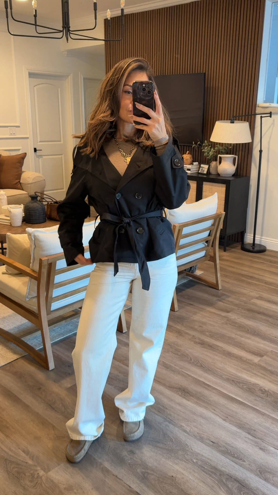 Minimal and elevated 🖤 This black trench coat instantly makes any outfit look polished. Styled with wide-leg cream jeans and casual sneakers for a modern, laid-back fall look. A closet staple that works for workwear, errands, or a casual night out.  Wearing medium 

black trench coat outfit, fall layering essentials, neutral style outfit, wide leg jeans fall, minimal chic outfit, polished fall look


#LTKSeasonal #LTKOver40 #LTKU