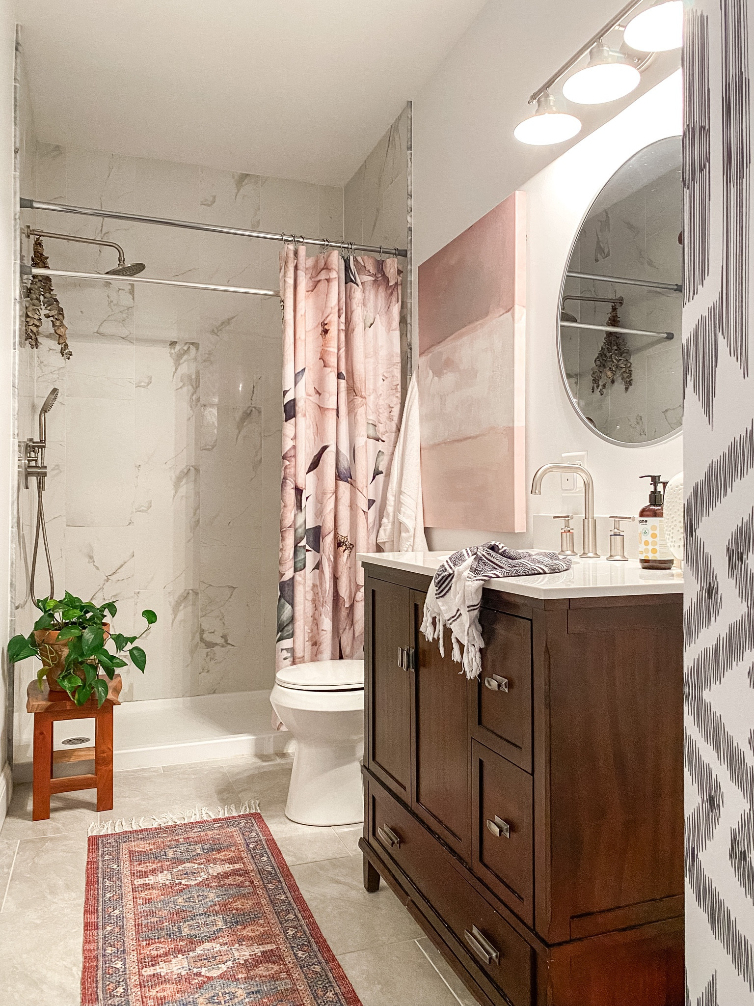 Washable runner from Walmart under $20. Better homes and gardens light, mahogany vanity, floral shower curtain, round mirror, amazon faucet
Bathroom decor, wood stool

#LTKsalealert #LTKhome #LTKxPrimeDay