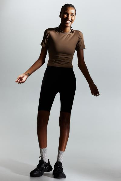 DryMove™ Cropped sports top - Brown - Ladies | H&M GB | H&M (UK, MY, IN, SG, PH, TW, HK)