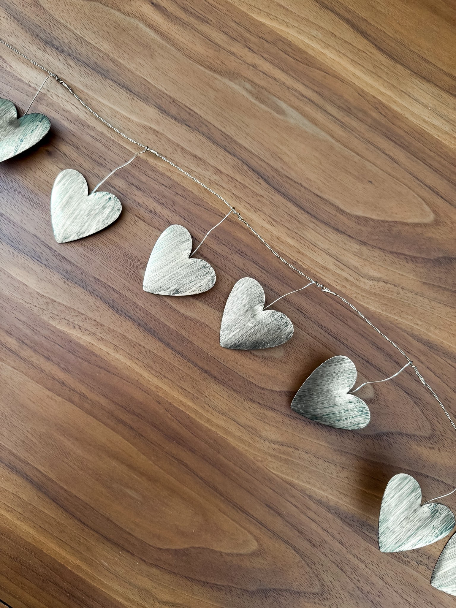 SELL OUT RISK | 
This gorgeous brass metal heart garland is giving effortless Valentine’s charm with a modern, elevated twist. The brushed brass hearts add just the right amount of warmth and shine, making it perfect for styling across a mantel, shelf, console table, or even draped over a headboard. It’s minimal, neutral, and timeless—easy to style for Valentine’s Day but subtle enough to leave up all year long. A simple decor piece that instantly makes your space feel cozy, romantic, and thoughtfully styled. I’m a big fan of mixed metals and simple neutral decor.
For reference: Garland is 72” long

brass heart garland • valentines heart garland • valentines decor • metal heart garland • valentines mantel decor • neutral valentines decor • target valentines decorations • modern valentines decor • farmhouse valentines decor • shelf decor valentines • brass home decor • heart garland Valentine’s Day

#ValentinesDecor #ValentinesDayDecor #TargetFinds #MixedMetalDecor #HeartDecor #NeutralDecor #ModernFarmhouseDecor #MinimalHome #HomeDecorInspo #SeasonalDecor #MantelDecor #ShelfStyling #CozyHome #AffordableDecor #ValentinesInspo

#LTKSeasonal #LTKFindsUnder50 #LTKHome