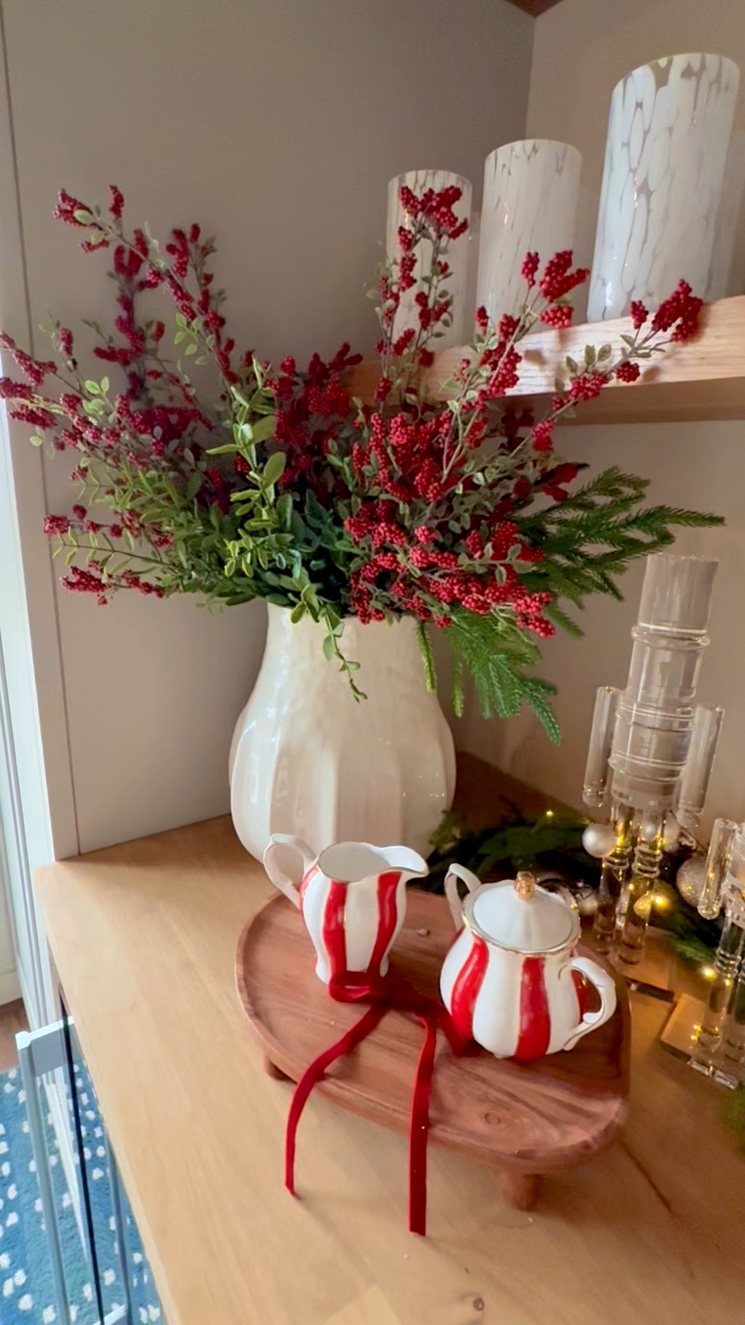 Holiday hosting made easy on one buffet. I layered greenery, candles, and pretty serving dishes to create an easy grab-and-go holiday setup you can use all season. Shop the decor and tableware I used to style this Christmas buffet below.