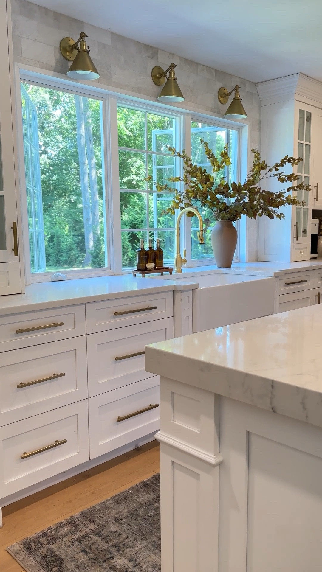 Kitchen lighting, backsplash, sink, faucet, area rug, cabinet hardware, artificial branches, vase. 

#LTKSaleAlert #LTKHome #LTKdayinmylife