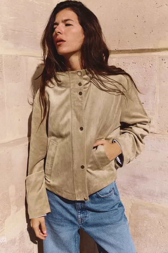 High-necked, long sleeve jacket with tabs. Front welt pockets. Elasticated hem at back. Concealed... | Zara UK