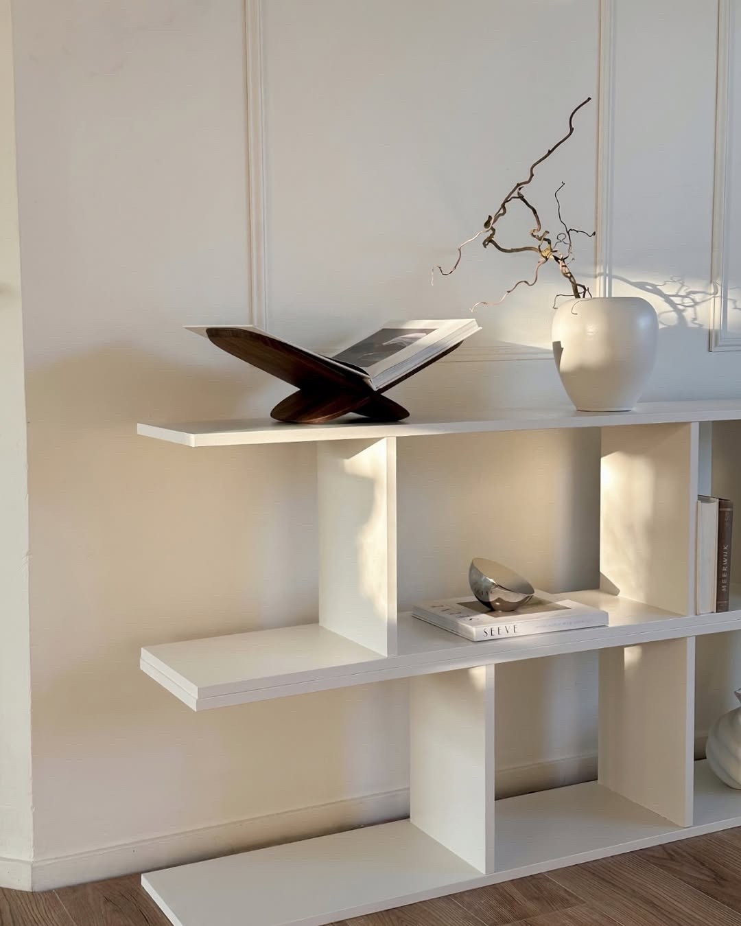 Elevating simplicity with intentional styling. This corner is a reminder that less truly is more — clean lines, subtle textures, and a soft, warm glow that shifts beautifully with the light. I styled this space with a balance of sculptural pieces and functional form: a wooden book stand for my favorite reads, a statement vase with dried branches, and curated coffee table books that bring inspiration daily. Every object here has space to breathe — creating visual calm and timeless elegance. You can shop this minimal and warm shelf styling via my LTK ✨ #ShelfStyling #MinimalDecor #InteriorDetails #NeutralVibes #WarmMinimalism #HomeStyling #DesignInspo #AestheticCorner #ShelfGoals #ModernDecor #CuratedHome

#LTKHome #LTKActive #LTKSeasonal