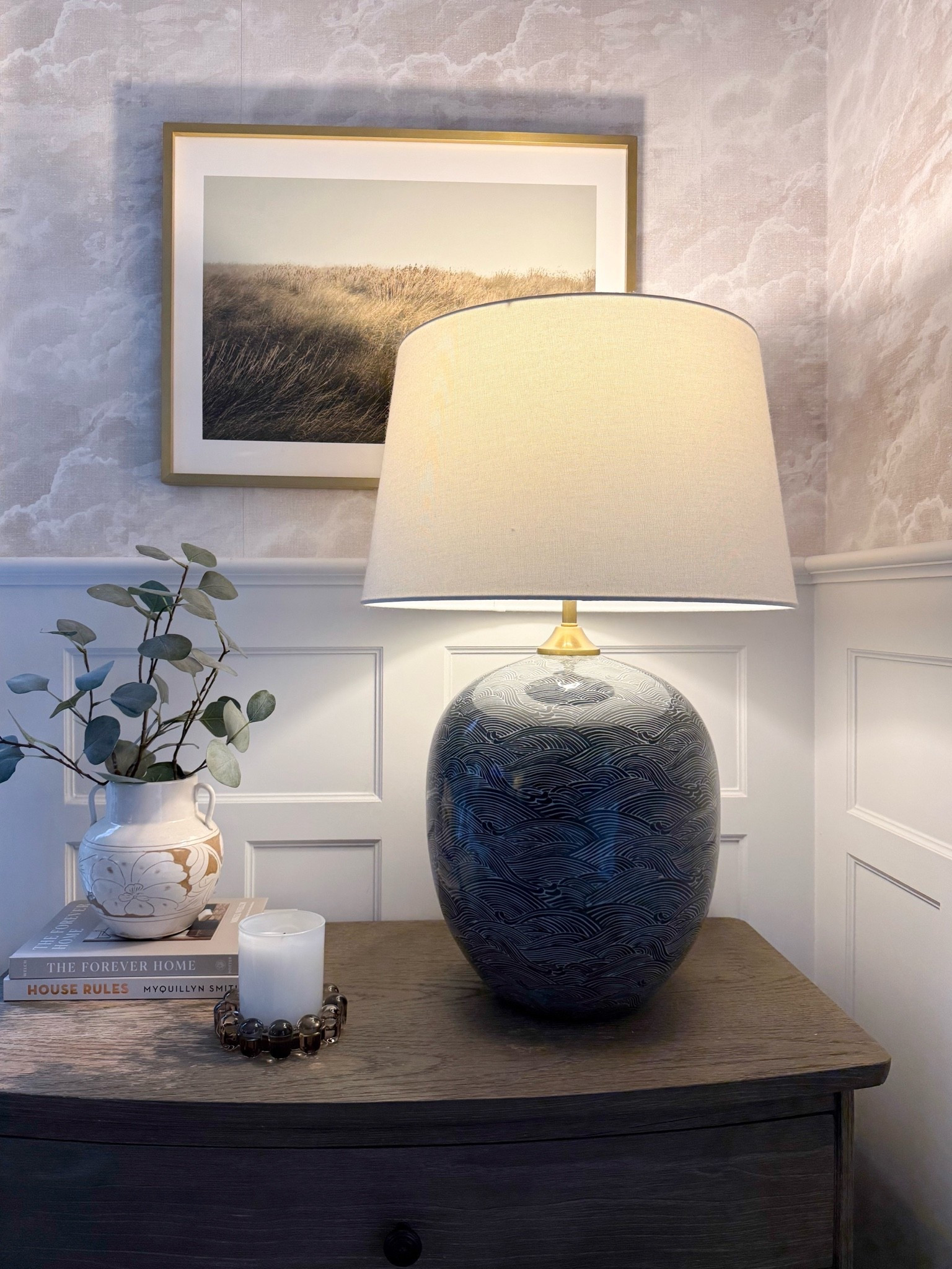 This little corner is such a beautiful mix of texture and contrast. The statement lamp, warm wood dresser, layered books, and simple greenery create a space that feels collected, calm, and timeless.

table lamp, statement lighting, bedroom decor, dresser styling, nightstand decor, neutral home decor, coastal home style, layered home accents, blue lamp, home styling ideas, timeless interiors, girlonthehudson

#LTKHome #LTKSeasonal #LTKdayinmylife