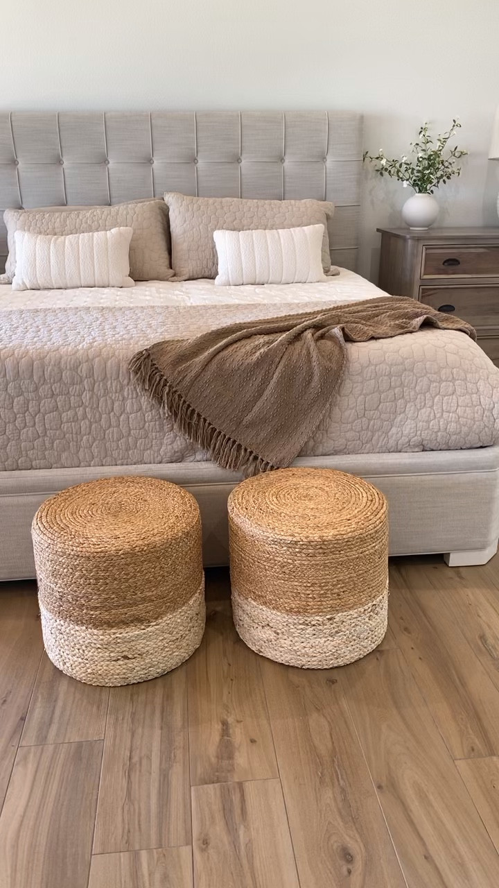Neutral bedroom decor. Coverlet, quilt, accent pillows, shakes, poof ottomans, vases, greenery stems, and bedside table lamp  

#LTKVideo #LTKHome