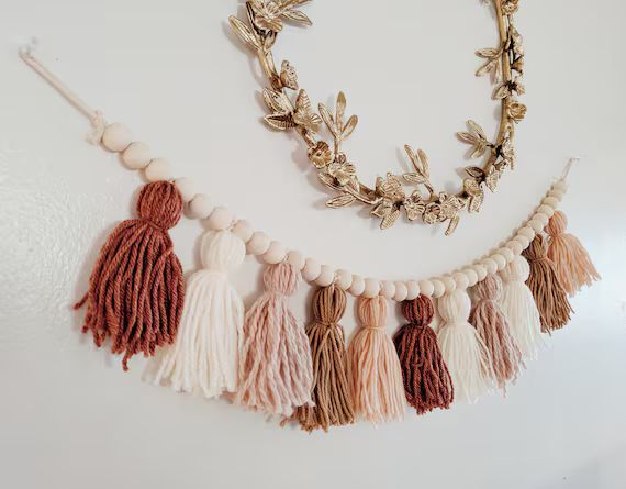Blush and terra cotta yarn tassel garland with wood beads / | Etsy | Etsy (US)
