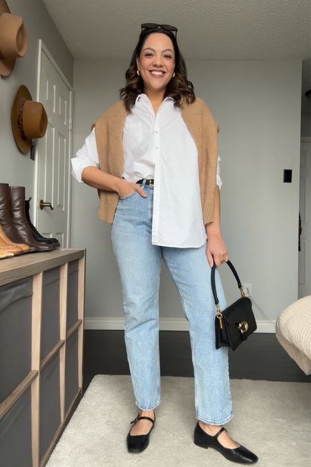 Styling a button down and jeans:
-Light wash straight jeans. 
-White button down shirt. 
-Tan sweater. 
-Coach tabby bag in black pebble leather. 
-Black Mary Jane’s. 
-Black belt with gold hardware. 
-Celine Triomphe sunglasses. 


#LTKfindsunder100 #LTKstyletip #LTKSeasonal