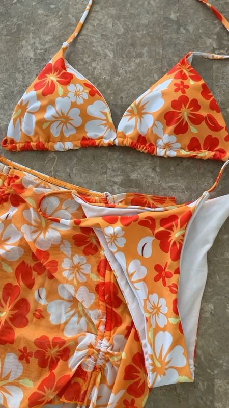Super cute 3 piece swimsuit set! I love the pretty bright colors for a tropical vacay and the coverup skirt is adjustable to your desired length of choice!! I will say it does run a bit small, especially in the chest area, so recommend sizing up🧡🏖️

#LTKswim #LTKSeasonal #LTKfindsunder50