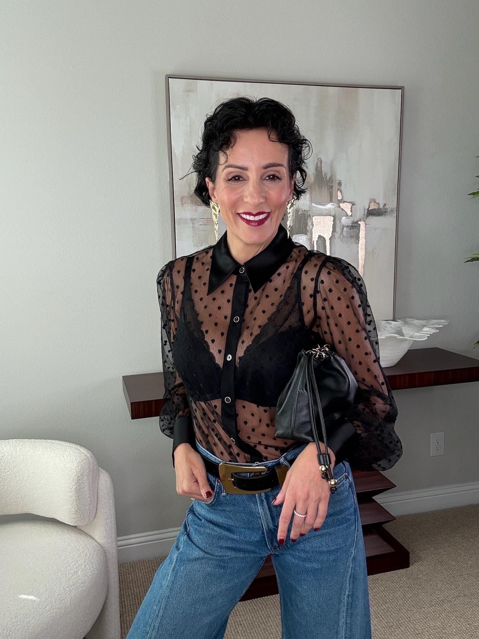 A black statement top is one of my favorite ways to make denim feel completely different. I love the mix of sheer polka dots and satin details here, especially paired with a great belt and simple accessories. It’s an easy combination for dinner or a night out when jeans still feel right.

black statement top, sheer blouse, polka dot blouse, black blouse, jeans outfit, date night outfit, dinner outfit, over 50 style, elevated denim, evening outfit, statement blouse, StyleWithEugenia

#LTKootd #LTKgrwm #LTKOver40