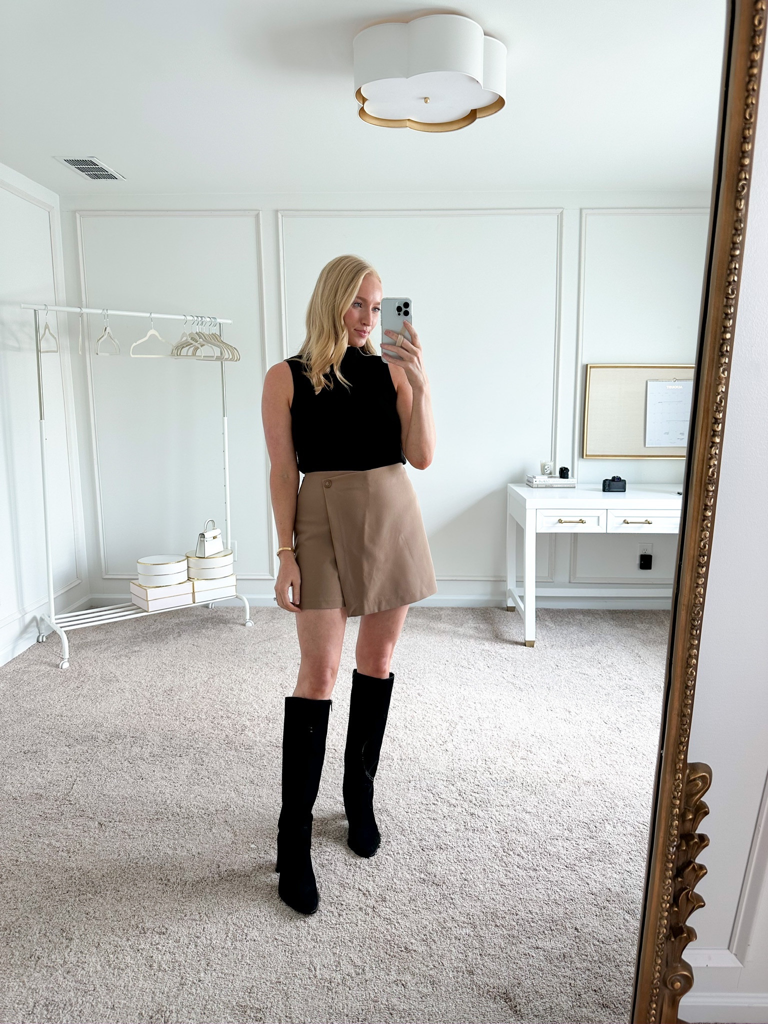 Early fall workwear look. Asymmetric skirt pairs perfectly with these black knee high boots. Could easily throw a blazer on top in cooler temps. 

#LTKworkwear #LTKSeasonal #LTKFind