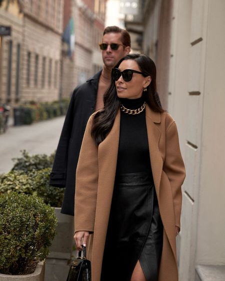 Kat Jamieson wears a camel coat, turtleneck, gold choker necklace, and cat eye sunglasses in Milan.

#LTKSeasonal #LTKstyletip #LTKitbag