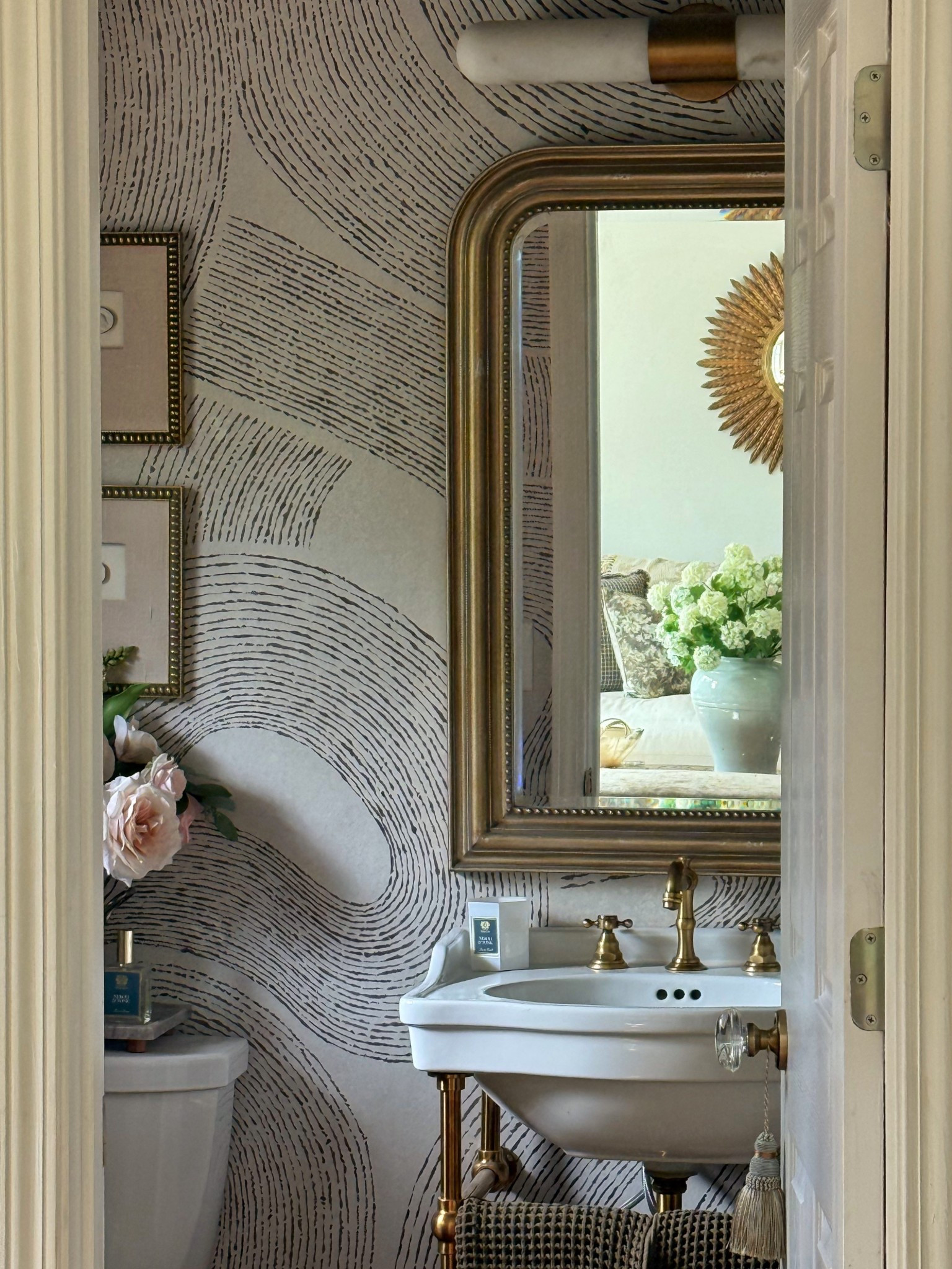 Proof that small spaces can still make a big statement ✨

This little powder room got the full moment—moody pattern, warm brass, and just enough vintage charm to feel collected (not crowded). She may be tiny, but she’s doing the absolute most… and honestly? I wouldn’t have it any other way.

#powderroom #smallspacestyle #interiorinspo #moodywalls #wallpaperlove #brassaccents #vintageinspired #homedecorideas #designdetails #collectedhome #bathroomdesign #cozycorners