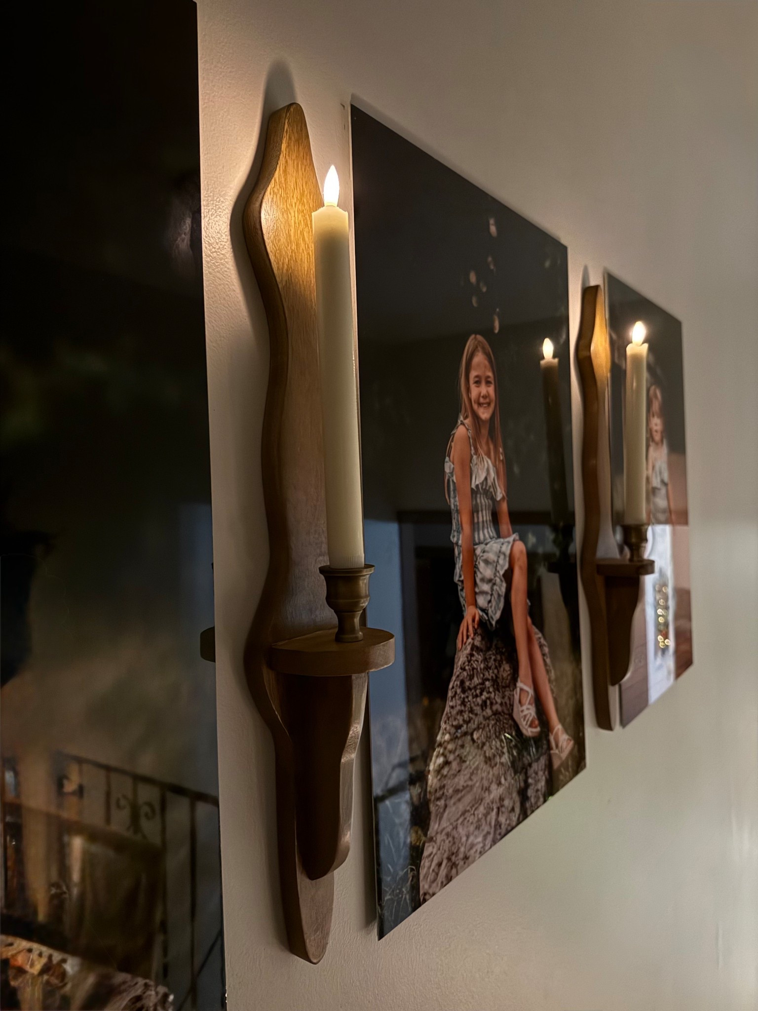 Create a cozy, timeless atmosphere with these wooden candle wall sconces, the perfect blend of modern farmhouse and vintage-inspired home decor. Featuring hand-finished natural wood and classic taper candle holders, these sconces add warm ambient lighting and architectural interest to any space. Styled here alongside framed family portraits, they beautifully elevate gallery walls, hallways, bedrooms, and living rooms with a soft, moody glow.

Ideal for those who love farmhouse wall decor, cottagecore interiors, and romantic lighting, these candle sconces bring warmth and character without overpowering your space. Use real or LED taper candles for a safe, elegant look that feels intentional and curated. Perfect for everyday styling or seasonal decorating, they make a stunning statement year-round.

✨ A must-have accent for anyone designing a cozy farmhouse home, vintage-inspired interior, or moody modern space. 
#candlewallsconce
#wallcandlesconce
#farmhousewalldecor
#modernfarmhousedecor
#vintagehomedecor
#cottagestyle
#moodyinteriors
#gallerywallinspo
#walllighting
#ambientlighting
#homedecorideas
#interiorinspo
#homeinspiration
#cozyhome
#romanticdecor
#neutralhomedecor
#woodwalldecor
#classicinteriors
#timelessdecor
#hallwaydecor
#bedroomdecor
#livingroomdecor
#homestyling
#interiordesignlovers


#LTKHome #LTKHoliday #LTKFindsUnder100
