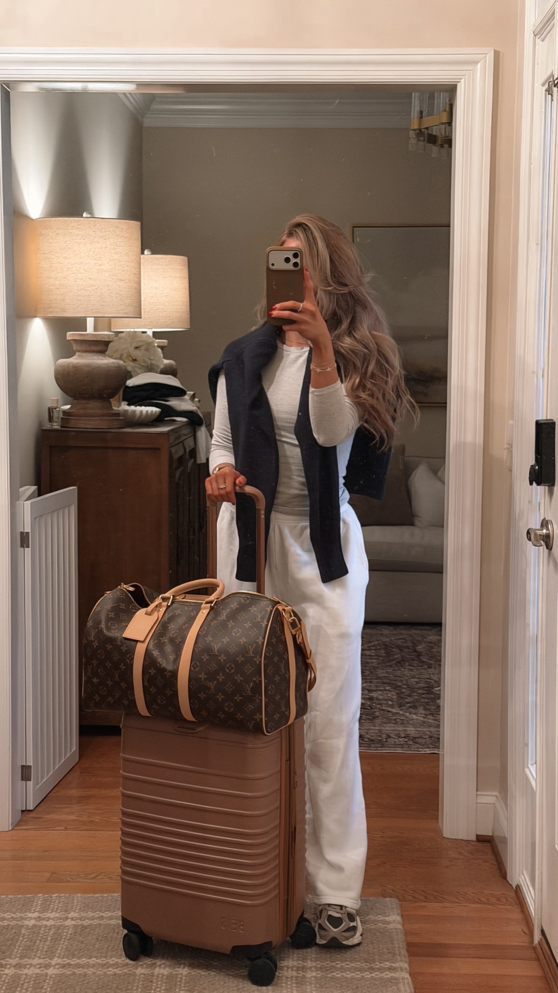 Off again! ✈️Airport outfit / travel day look!
neutral travel outfit, airport style, women’s travel outfit, comfy travel clothes, elevated athleisure, matching lounge set, white lounge set, long sleeve top, wide leg sweatpants, cozy travel outfit, carry on luggage, rolling suitcase, travel essentials, Louis Vuitton duffle bag, personal item bag, weekend travel outfit, chic airport look, casual travel outfit, minimalist travel style, capsule wardrobe travel, everyday basics, neutral outfit inspo ✨

#LTKTravel #LTKootd #LTKgrwm