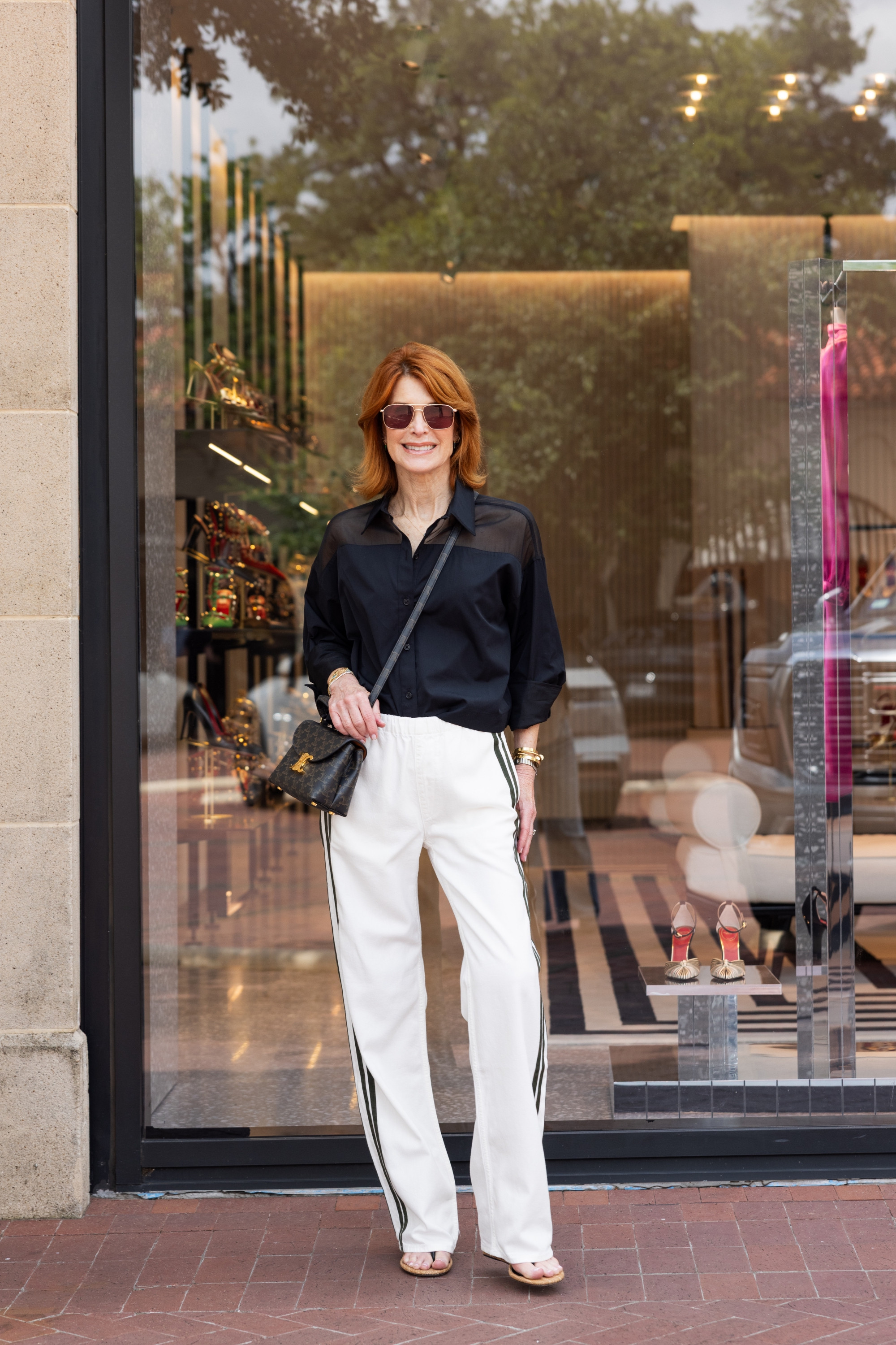 This is the kind of travel outfit I love — comfortable, lightweight, and still pulled together. These white track pants with a black organza shirt are perfect for travel days, lunch, errands, or casual work outfits. Wearing an XS in both. #TravelOutfits #WorkOutfits #SummerOutfits 

  

#LTKootd #LTKOver40 #LTKootd #LTKSeasonal #LTKOver40