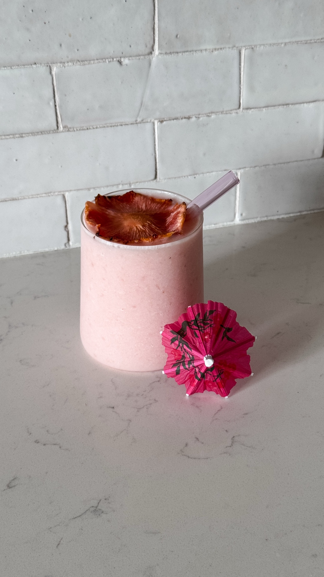 Pink piña colada 🥥🍍🌸  Did you know there is a pineapple that is pink inside? I had no idea! Found this one at my local @foodlion so decided to make piña colada as the puertorriqueña I am🫶🏻 

Piña colada:
2 cups of frozen pineapple 
2 cups of ice
6 - 8 tbsp of cream of coconut - to taste based on sweetness preference (use only Coco Lopez brand )
Blend together 

Pineapple flowers:
Slide into thin layers
Bake at 200F for 1 hr in a cupcake pan

* You can add run but I prefer it virgin 🌸🫶🏻