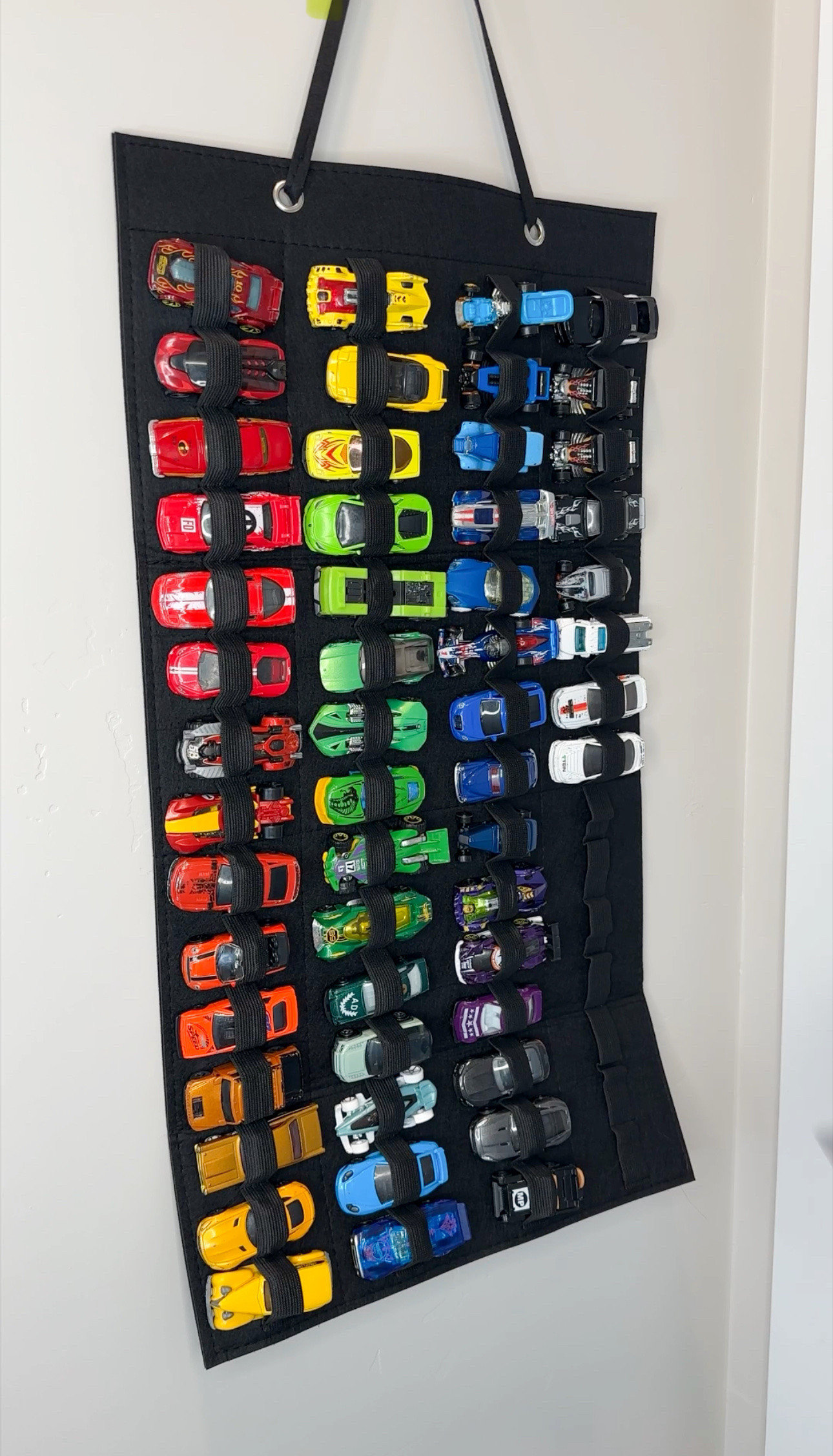 This is a really great way to organize your hot wheels! It can be difficult to stay on top of toy organization, but this is a great organization idea to help you keep your sanity. #playroomidea #playroomorganization #toyorganization #hotwheels #toystorage 