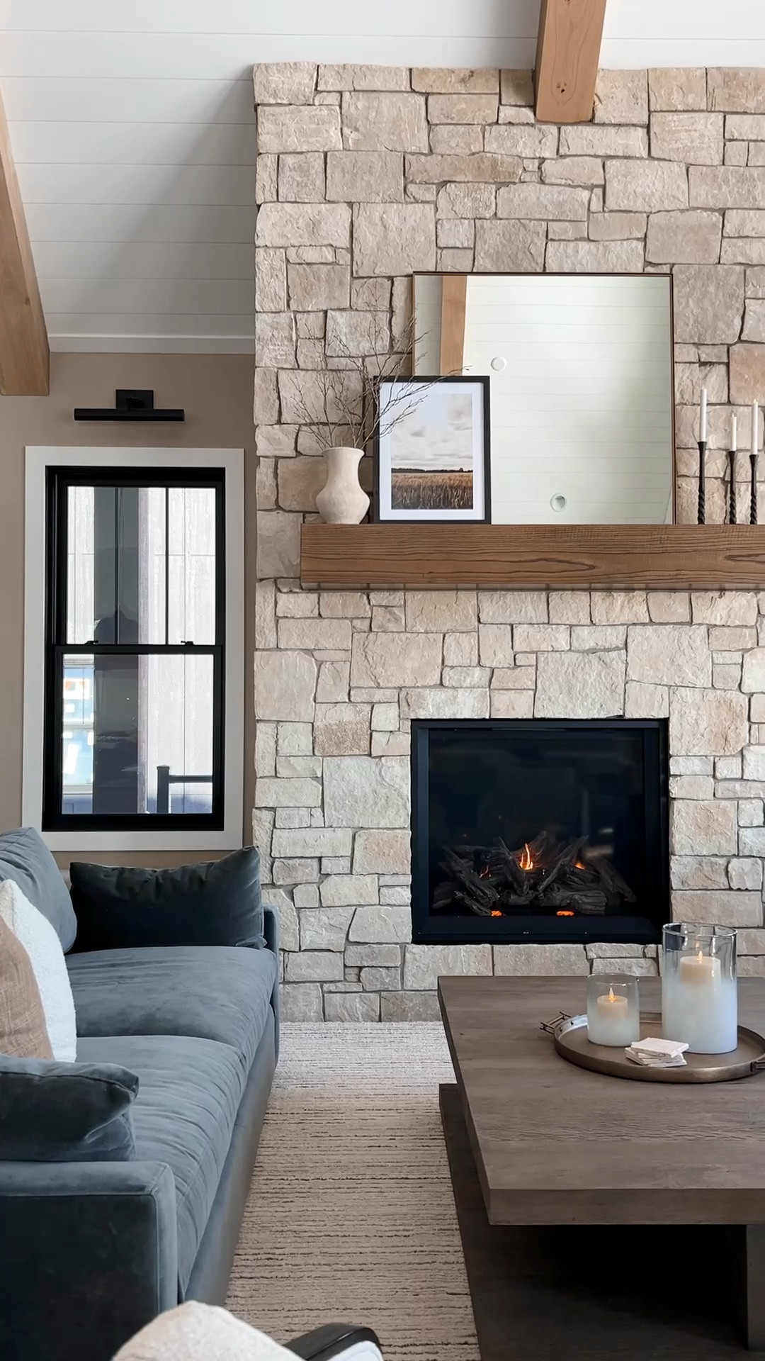 How I styled my oversized mantle. I wanted it to feel natural so I used a rustic vase with some sticks paired with an oversized mirror and layered artwork. Of course I had to add flameless candles!

#LTKhome #LTKstyletip