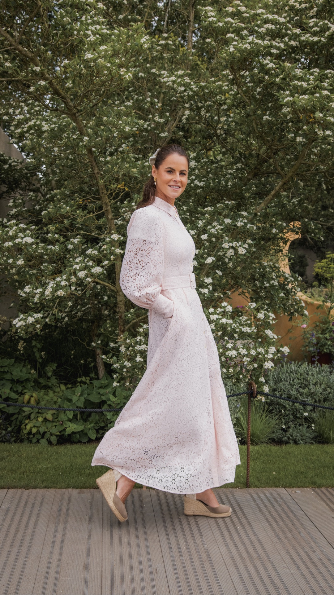 Today I’m wearing our Iona Lace Dress in Blush, paired with the Knightsbridge Blazer in Hot Pink Bouclé. I wanted something feminine, polished, and perfect for a day surrounded by beautiful florals and British summertime elegance.

I’ve also been living in these wedge espadrilles all week — effortlessly elegant and so comfortable for long days at Chelsea.
