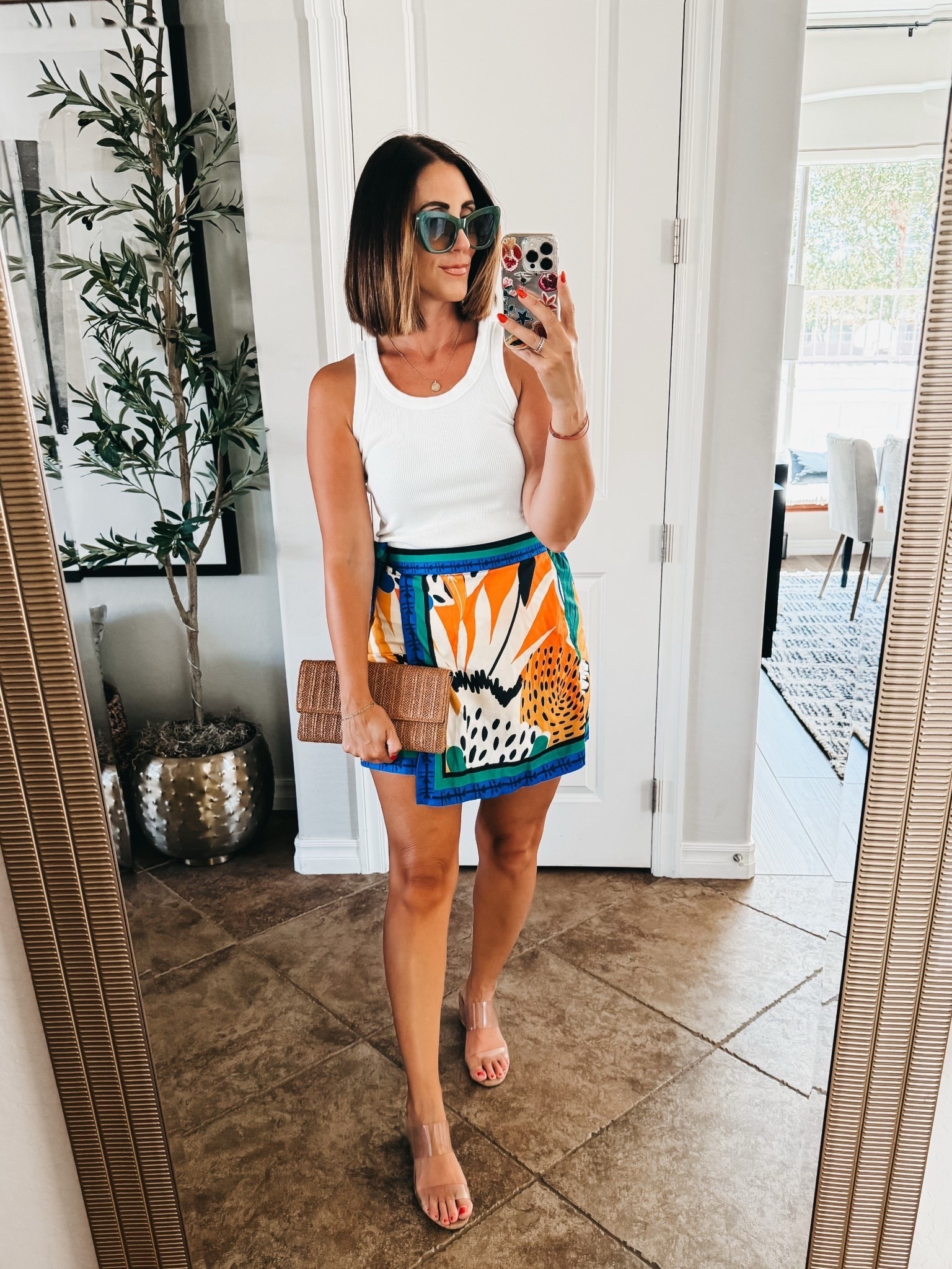 Easy vacation outfit! 🌴🧡🕶️🍹

Ribbed tank and colorful, patterned skort with faux wrap waist!! 

- tank - size small 
- skirt - sized up one to a medium #LTKFindsUnder50

#LTKootd #LTKTravel #LTKOver40