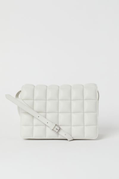 Bag with a narrow, adjustable shoulder strap, a flap, and an inner compartment with zipper. Lined... | H&M (US + CA)