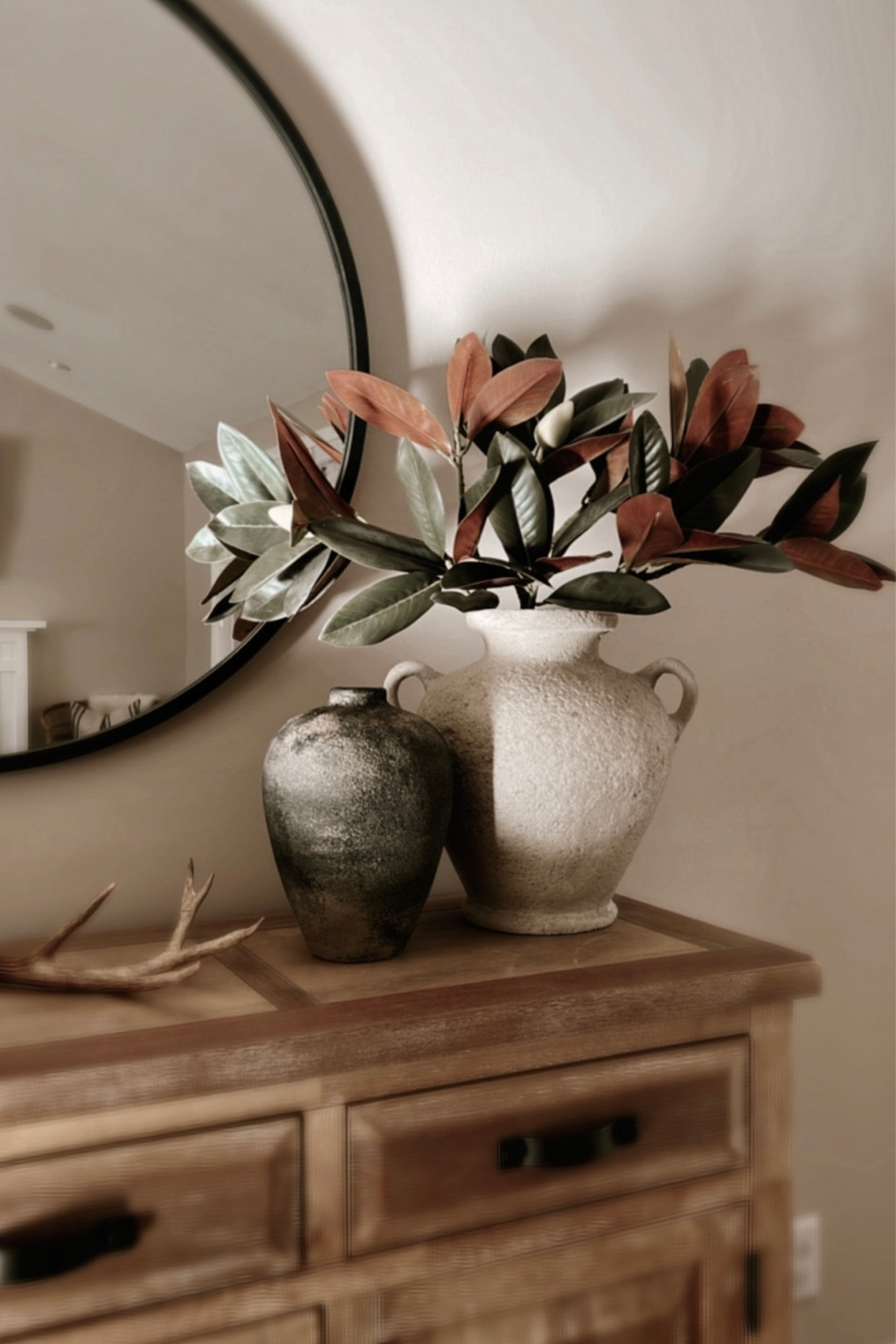 Simple and chic seasonal decor • holiday decor • faux magnolias • decorative vase • winter decor • seasonal console • winter console • holiday entryway

#LTKSeasonal #LTKhome #LTKHoliday