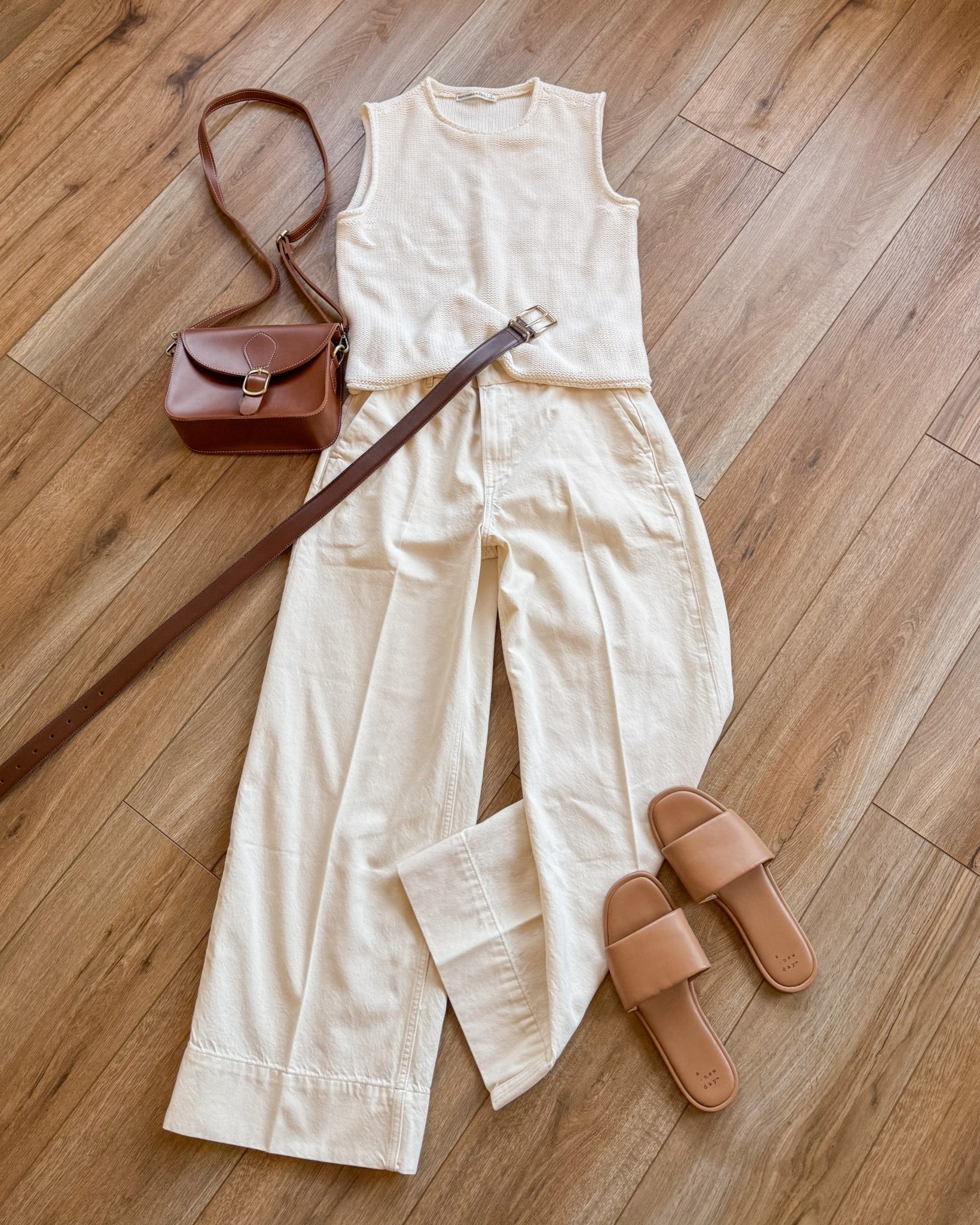 crisp all white outfit for springtime. casual spring outfit. wide leg cream trousers. sleeveless sweater. spring break outfits. 

#LTKSpringSale #LTKootd #LTKSaleAlert