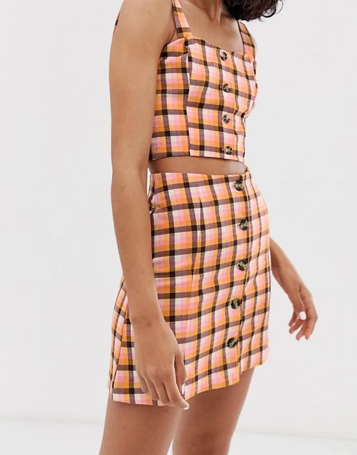 Monki two-piece check print mini skirt with button details in pink | ASOS (Global)