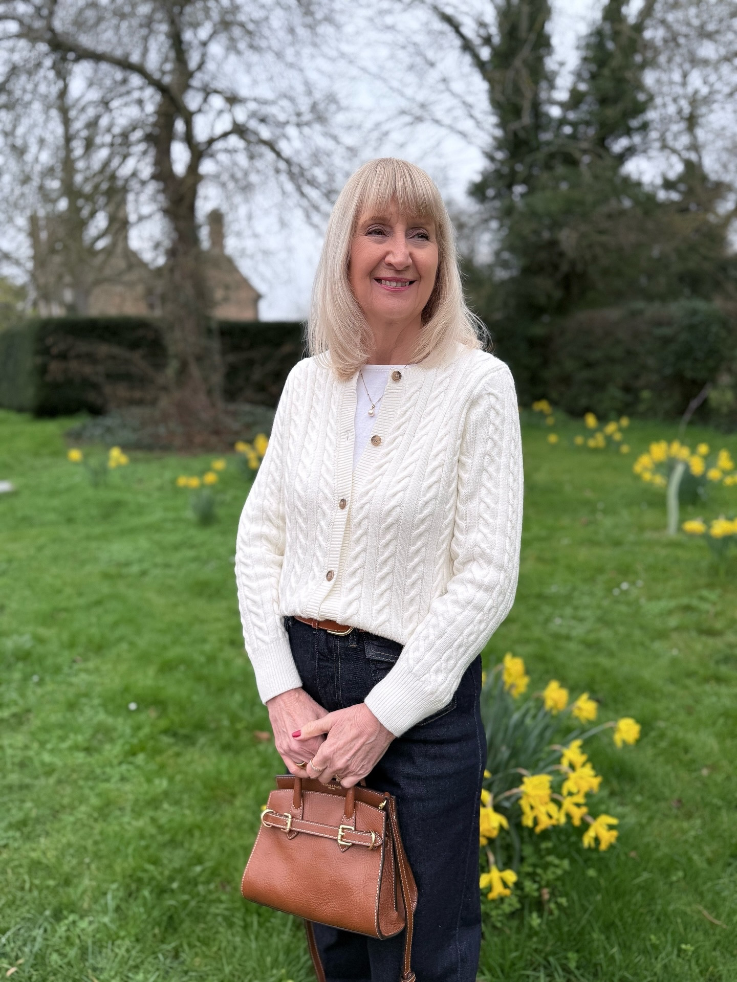 Spring Outfits 2026 
Daffodils, crocuses and a little bit of blossom magic. 

Spring has officially arrived🌸🌼

Add a cup of coffee in a cosy cafe and a cute spring outfit and I’m in heaven. 

I enjoyed all of these at the weekend, even though the sun didn’t oblige. 

I gave my new bag from the Town and Country Collection by @fairfaxandfavor x @lydia a little outing too and I love it. The leather is such a beautiful colour and I’m loving the white top stitching. I see it has been restocked so get in fast if you had your eyes on one too. 

I teamed it with a simple cable knit with jeans for a casual weekend look. 

What are your favourite parts of Spring? 

Cardigan : @cottontradersuk ad/pr 
Jeans : @marksandspencer *
Boots : @vandalshoes *
Bag : @fairfaxandfavor 
Belt : @andotherstories 

*previously declared pr products 

#fairfaxandfavor #springoutfit #springstyles #over40fashion #cableknit

#LTKspring #LTKover50style #LTKuk