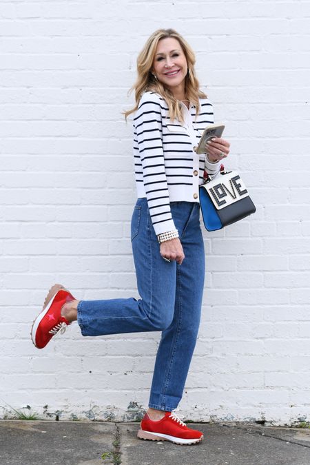 Cutest spring look!  Navy striped cardigan from Sezane, AYR jeans, red sneakers and a fun bag!  

#LTKitbag #LTKshoecrush #LTKstyletip